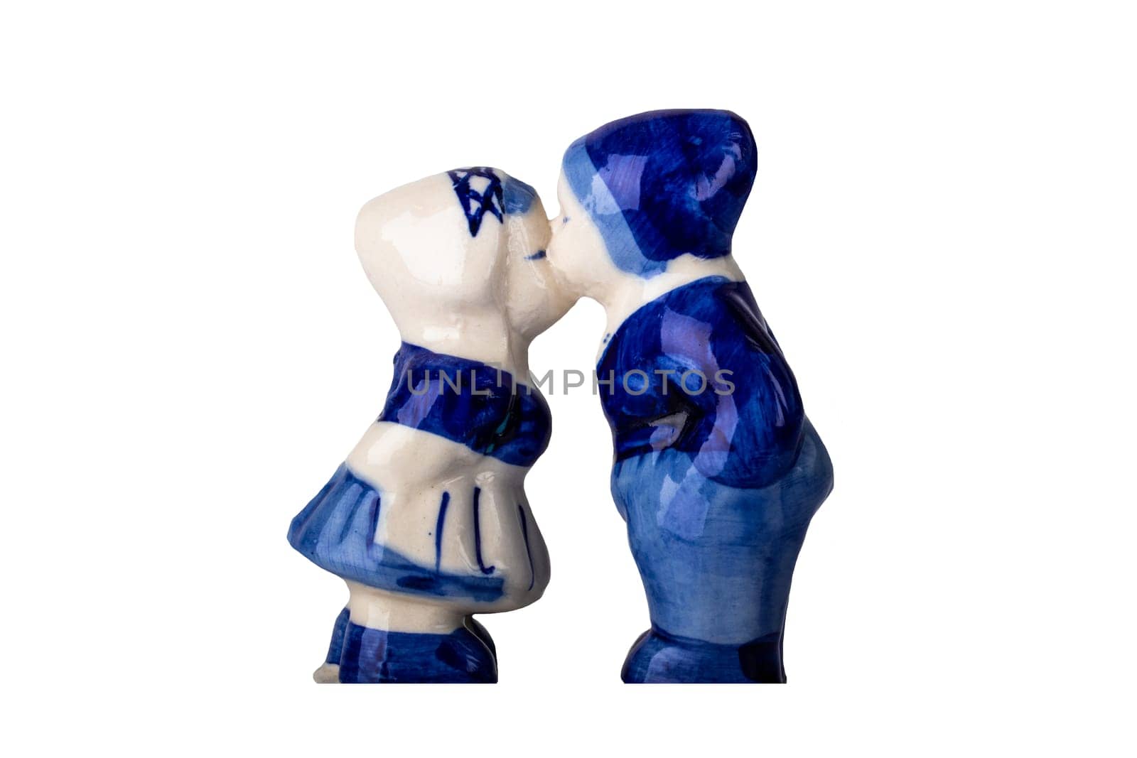 Porcelain figurines. Kissing boy and a girl in traditional Dutch costumes.