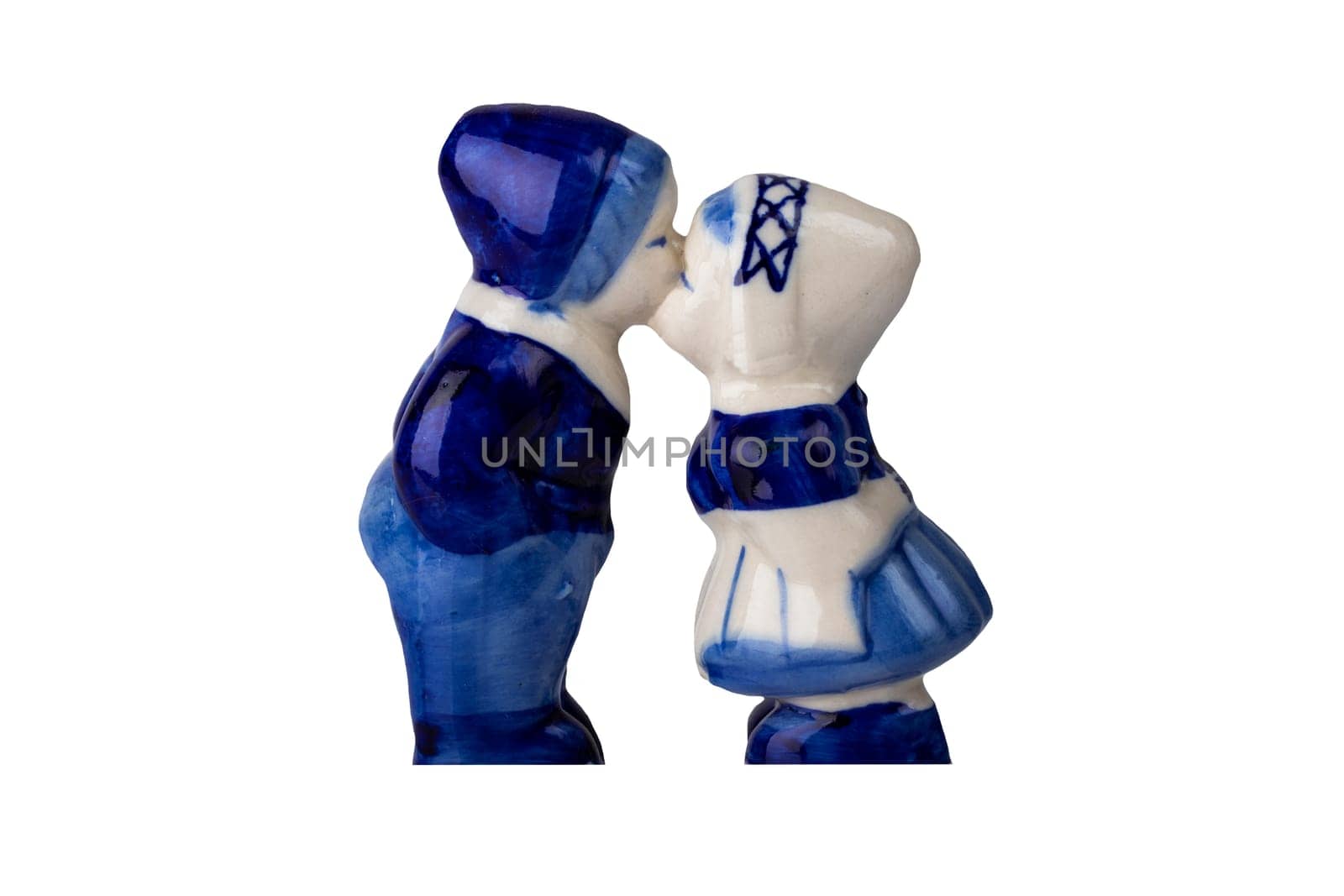 Porcelain figurines. Kissing boy and a girl in traditional Dutch costumes.