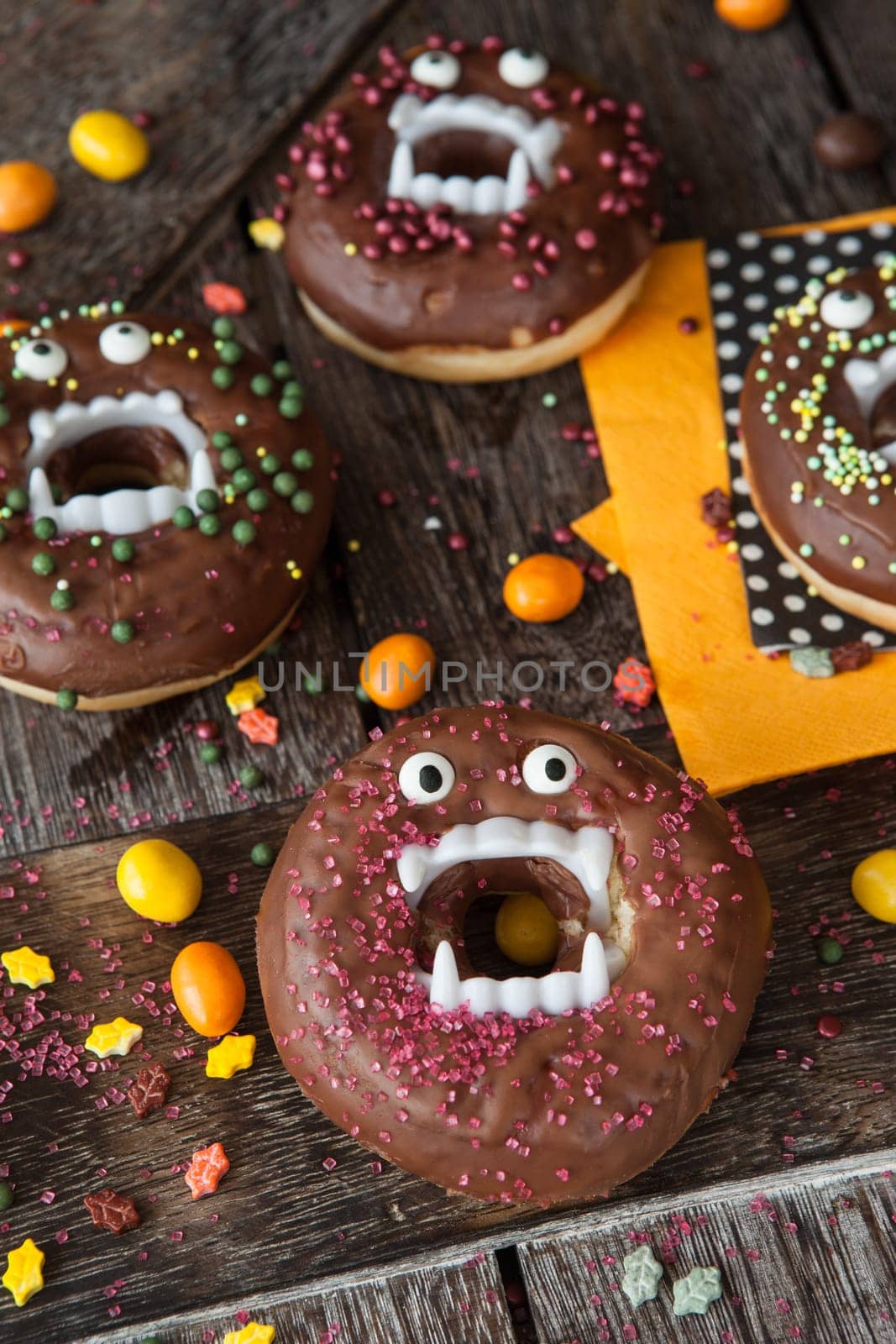 Scary Halloween donuts with chocolate frosting and sugar sprinkles