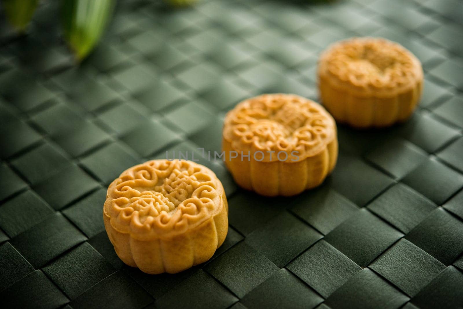 Traditional moon cakes is offered to friends or family during Mid-Autumn Festival. The Chinese character represent "lotus paste"" in English."