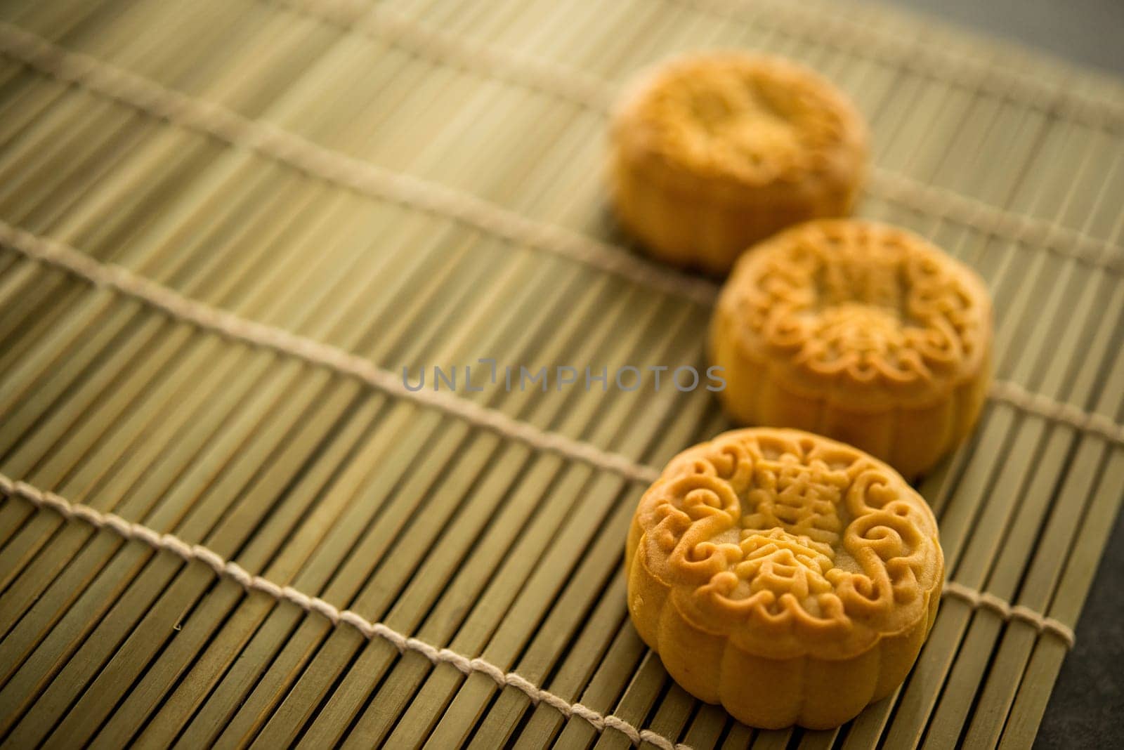 Mooncakes is traditionally baked pastry to eaten during Mid-Autumn Festival. The Chinese character represent "lotus paste""."