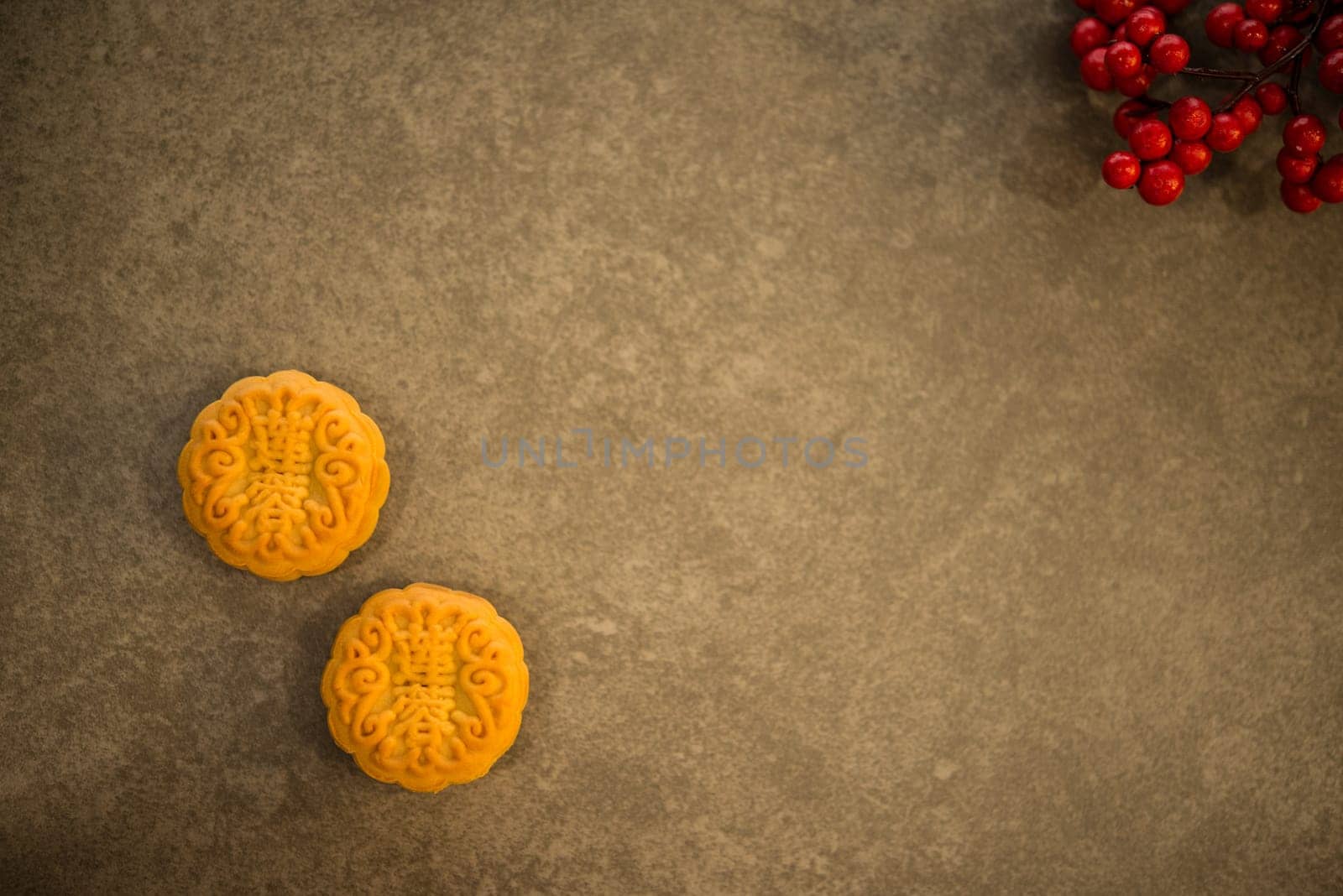 Mooncake is traditional pastry eaten during the Mid-Autumn Festival. Flatlay on table top with copy space. The Chinese character represent "lotus paste""."