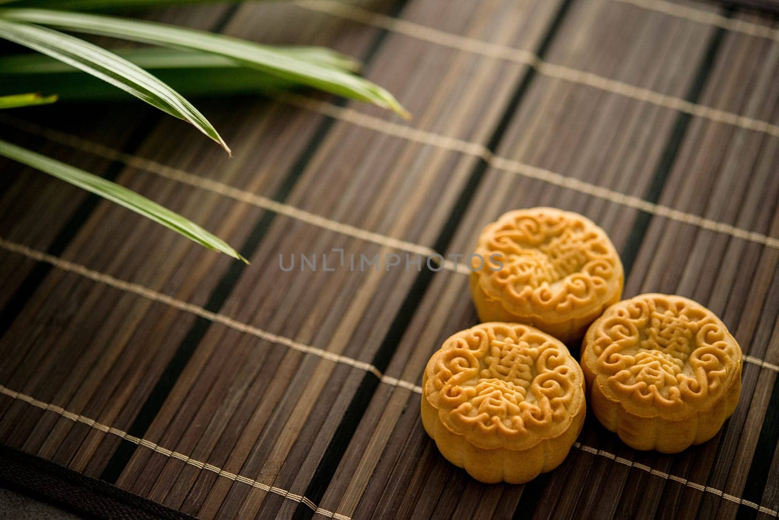 Traditional baked moon cakes is offered to friends or family during Mid-Autumn Festival. The Chinese character represent "lotus paste"" in English."