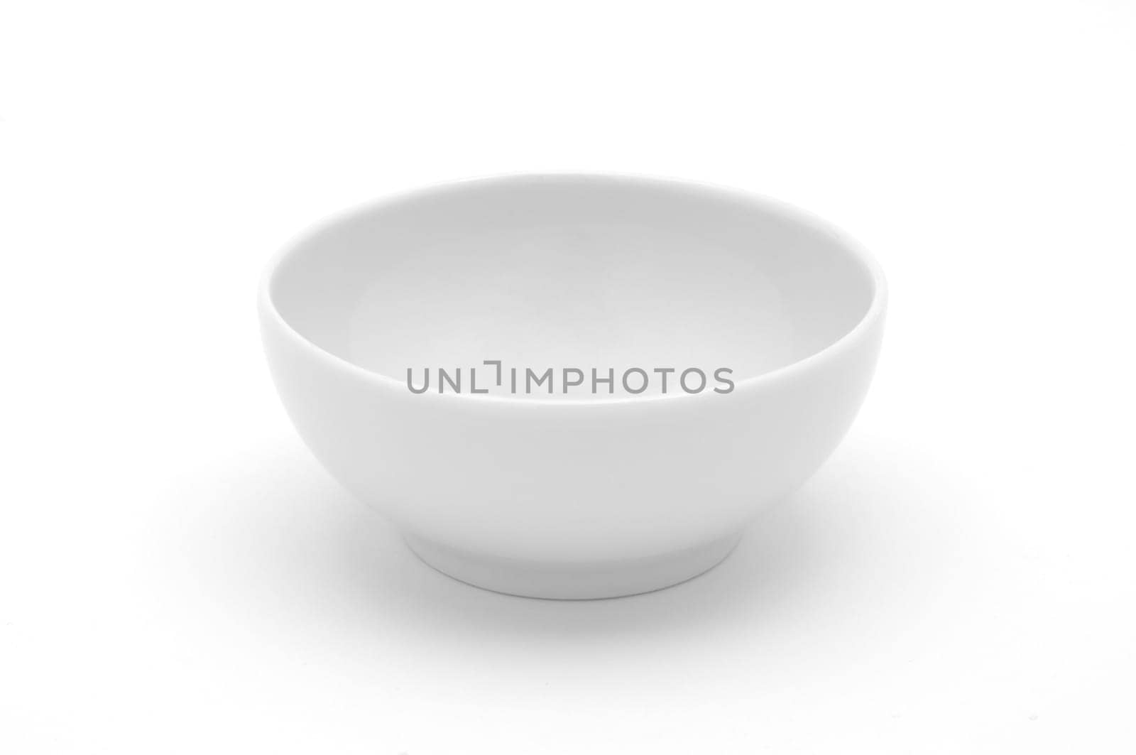 Empty white ceramic cup on white background isolated.
