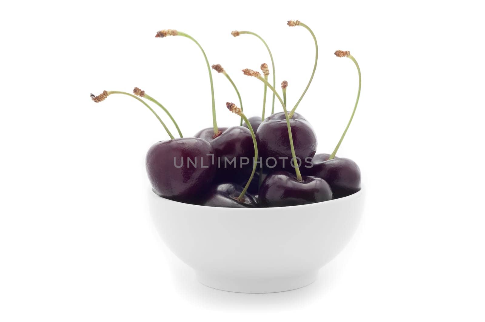 White cup with dark cherries. On a white background.