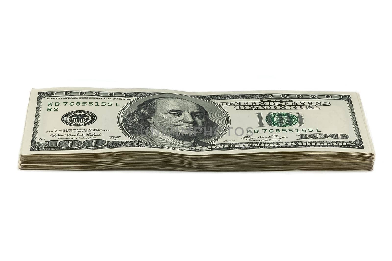 A small stack of one hundred dollar bills on a white background. View at an angle. Isolated.