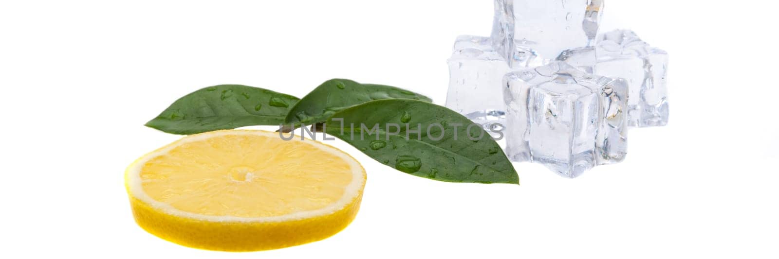 Round slice of bright, fresh, juicy lemon and a side view of a few green leaves and ice cubes on a white background. isolated.
