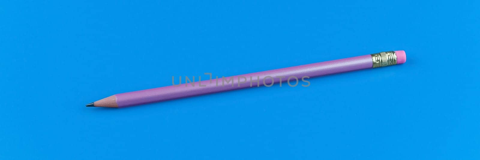 One purple pencil on a blue background.
