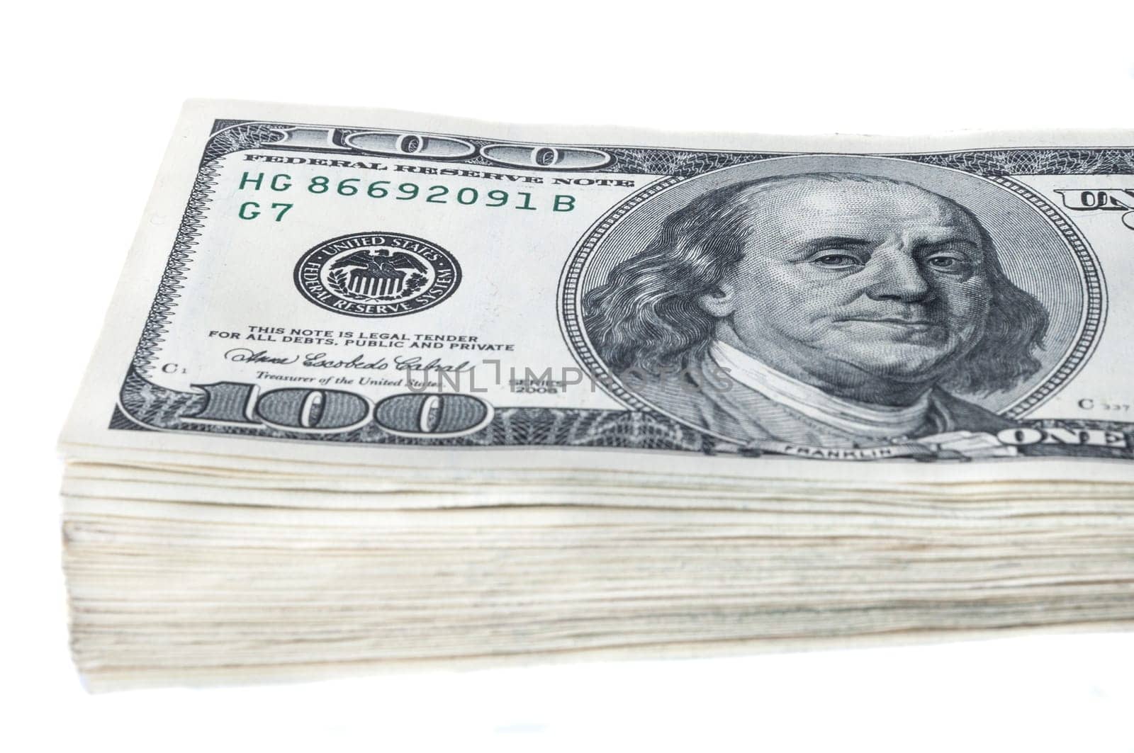 A bundle of ten thousand American dollars in bills of one hundred dollars. Isolated.