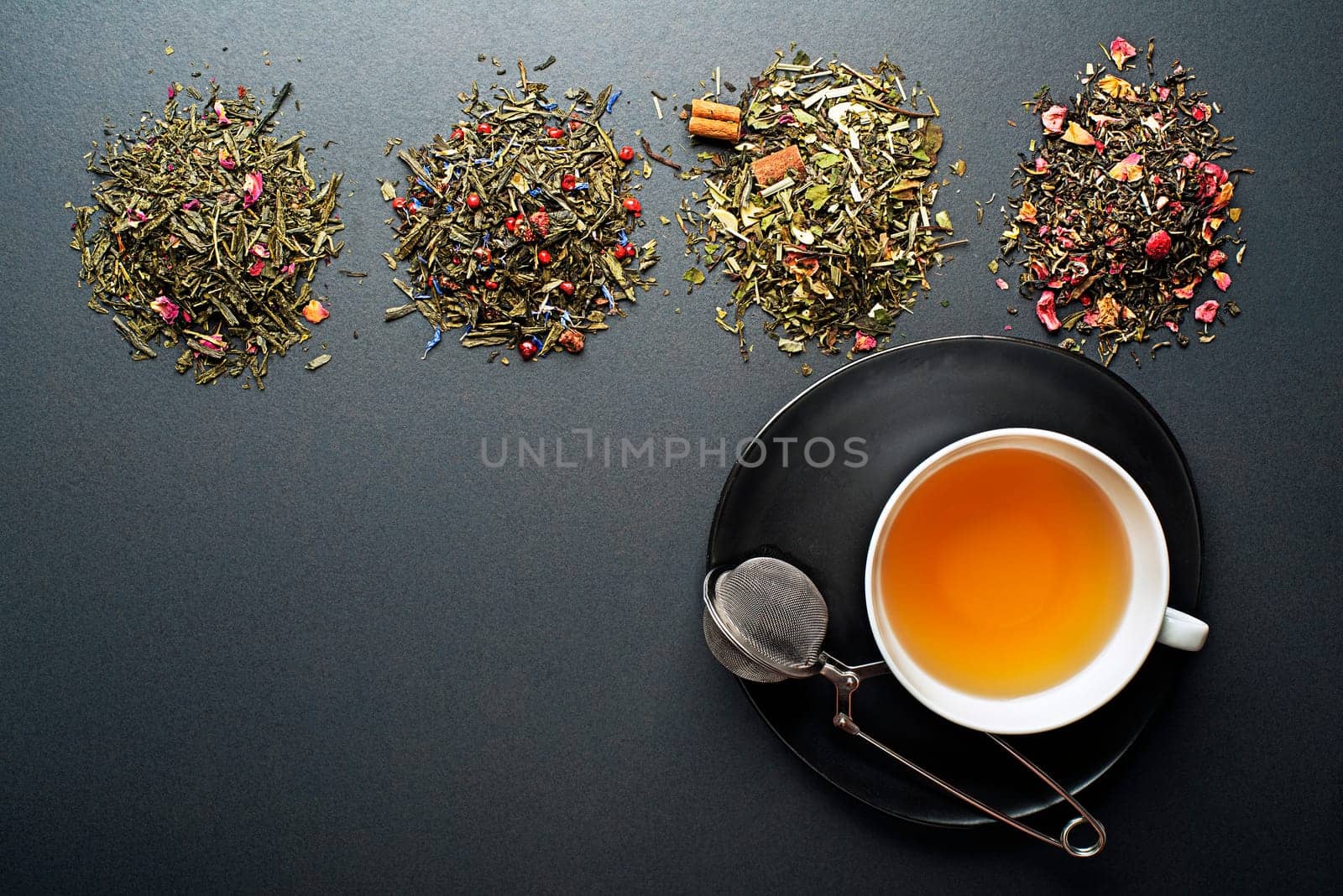 Cup of tea with dry tea collection of different types