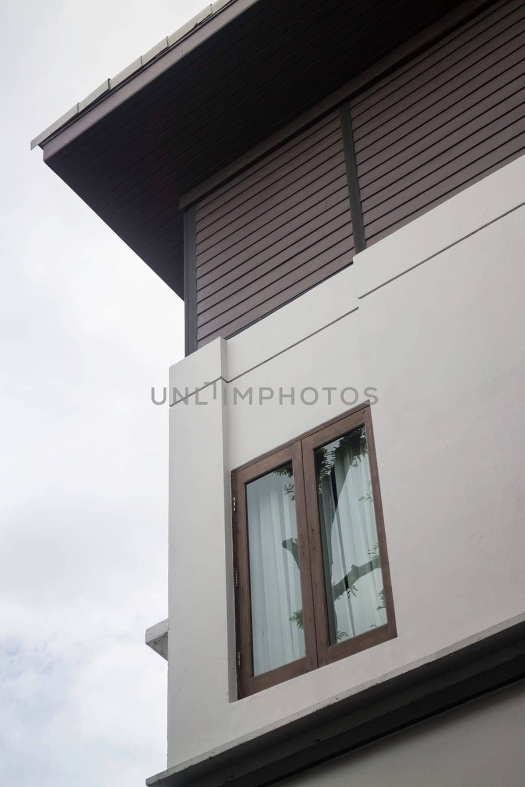Residential home with cloudy sky, stock photo