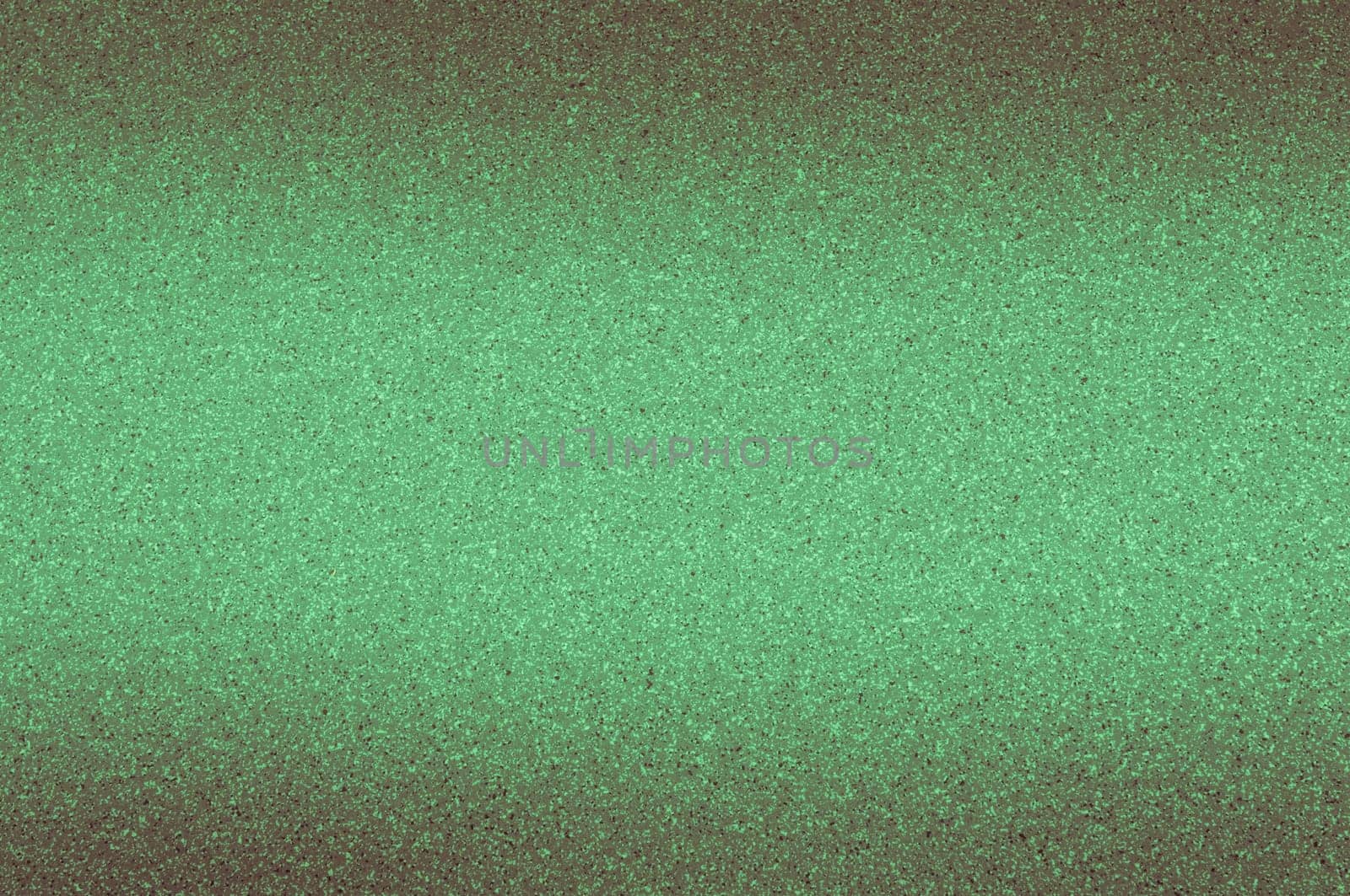 Granite background of green color with small dots.