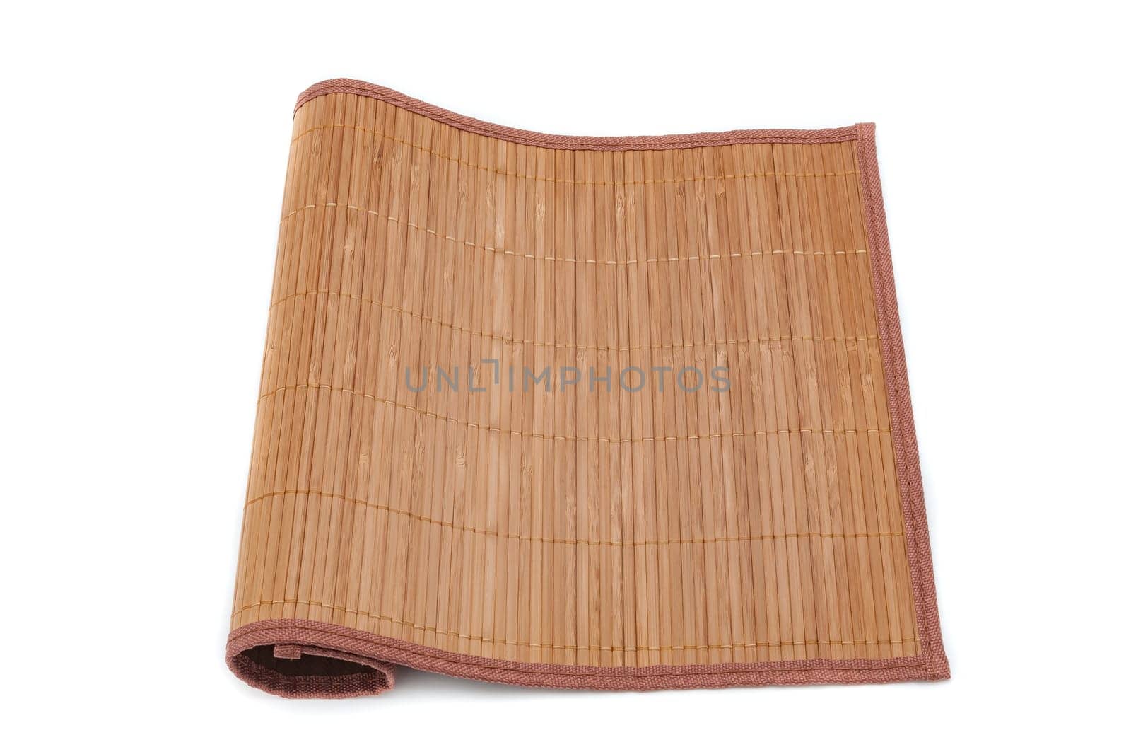 A bamboo mat on a white background is tucked on one side.
