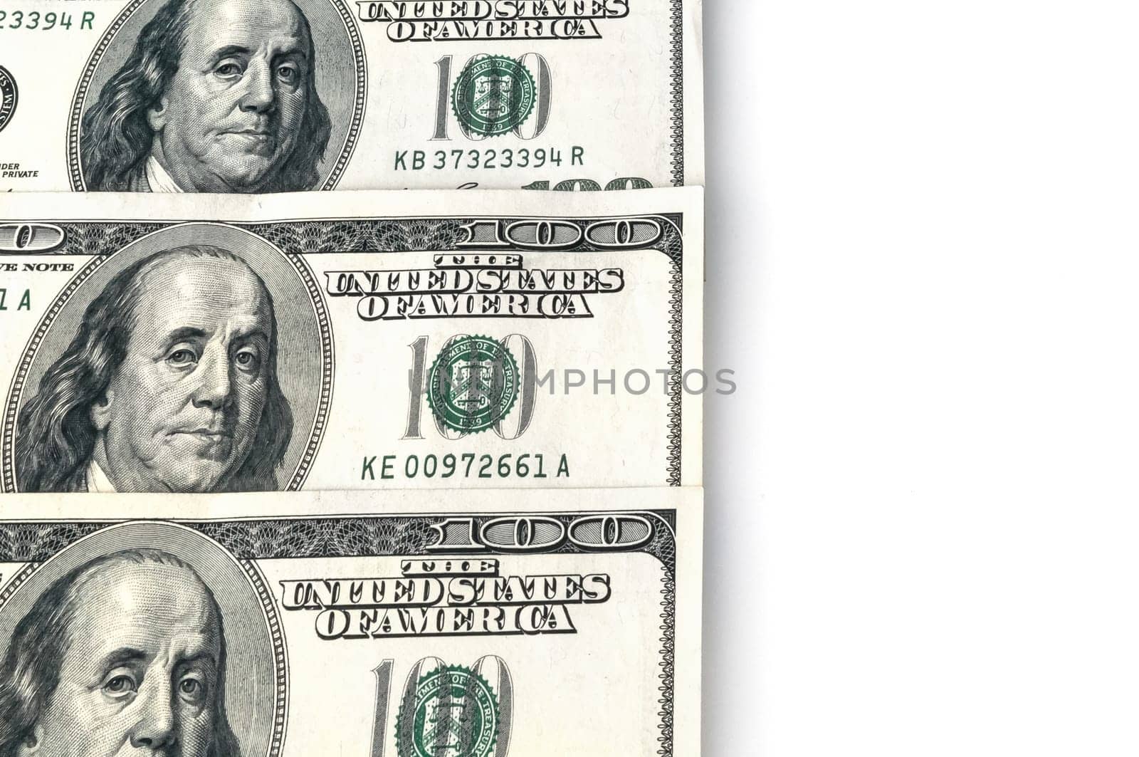 The background of the lying on the left side of the banknotes is one hundred dollars and the white part on the right.