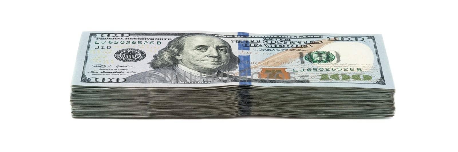 Ten thousand dollars in a pack of one hundred dollars. View at an angle. Isolated.