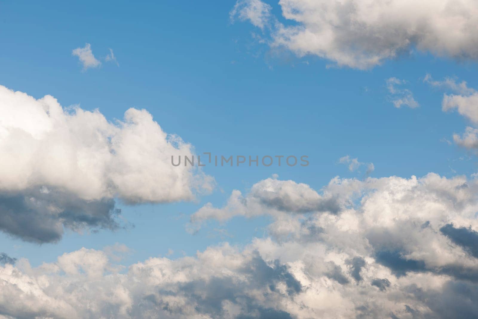 Conjuring storm clouds at an early stage in the blue sky.