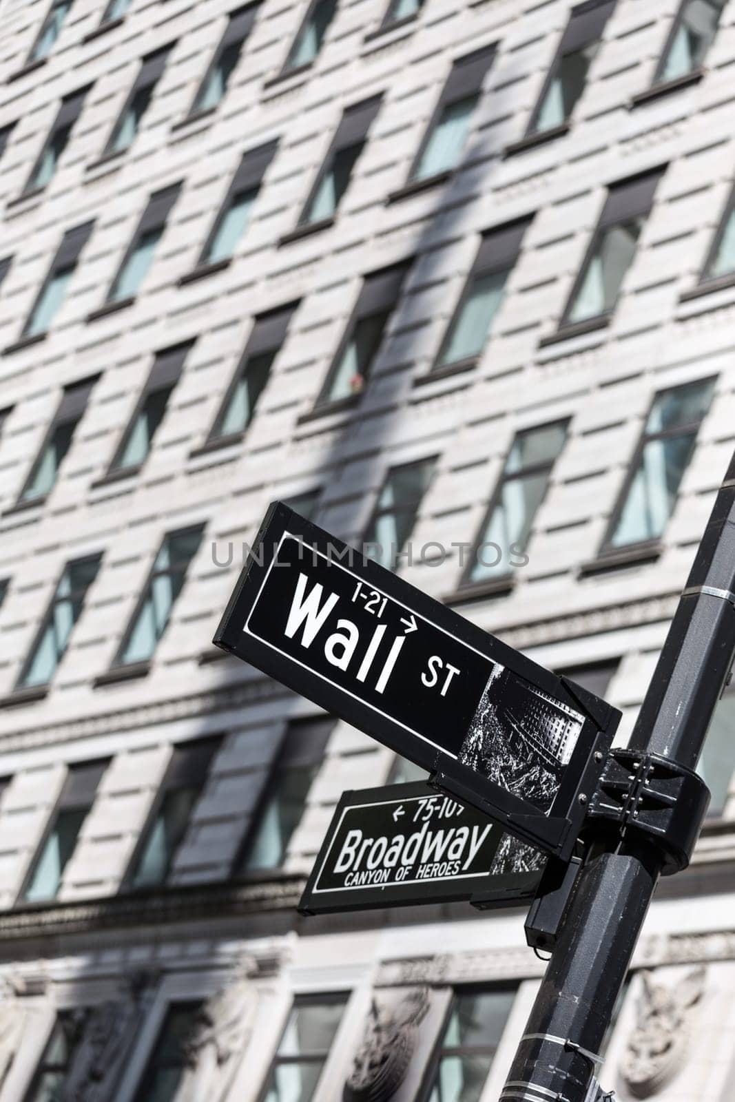 Wall St. street sign in lower Manhattan, New York City, USA.