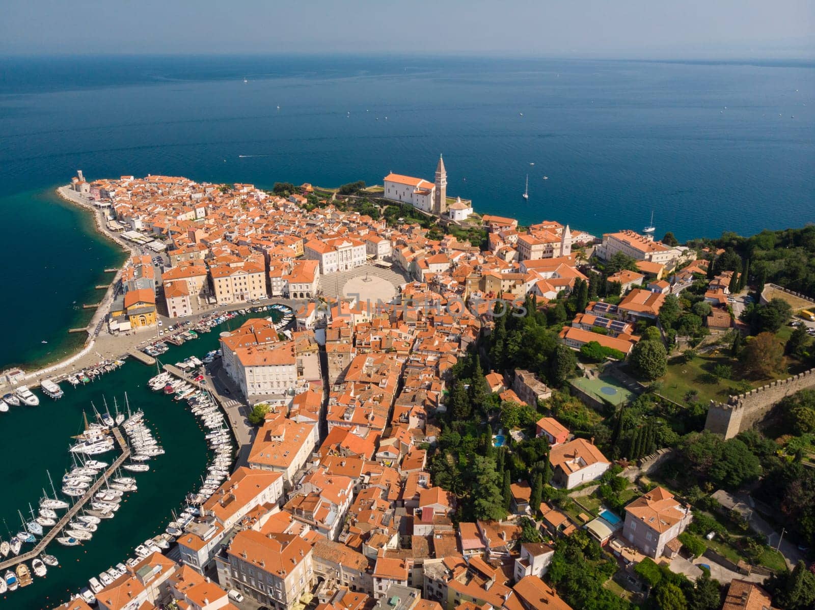 Aerial view of old town Piran. Splendid summer day on Adriatic Sea. Beautiful cityscape of Slovenia, Europe. Traveling concept background. Magnificent Mediterranean landscape.