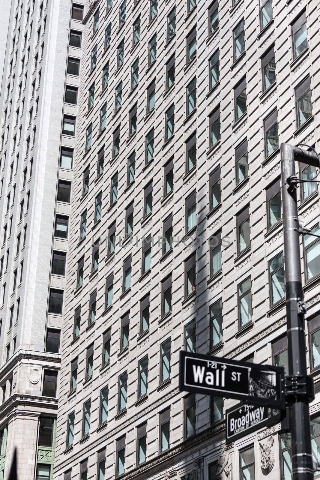 Wall St. street sign in lower Manhattan, New York City, USA.