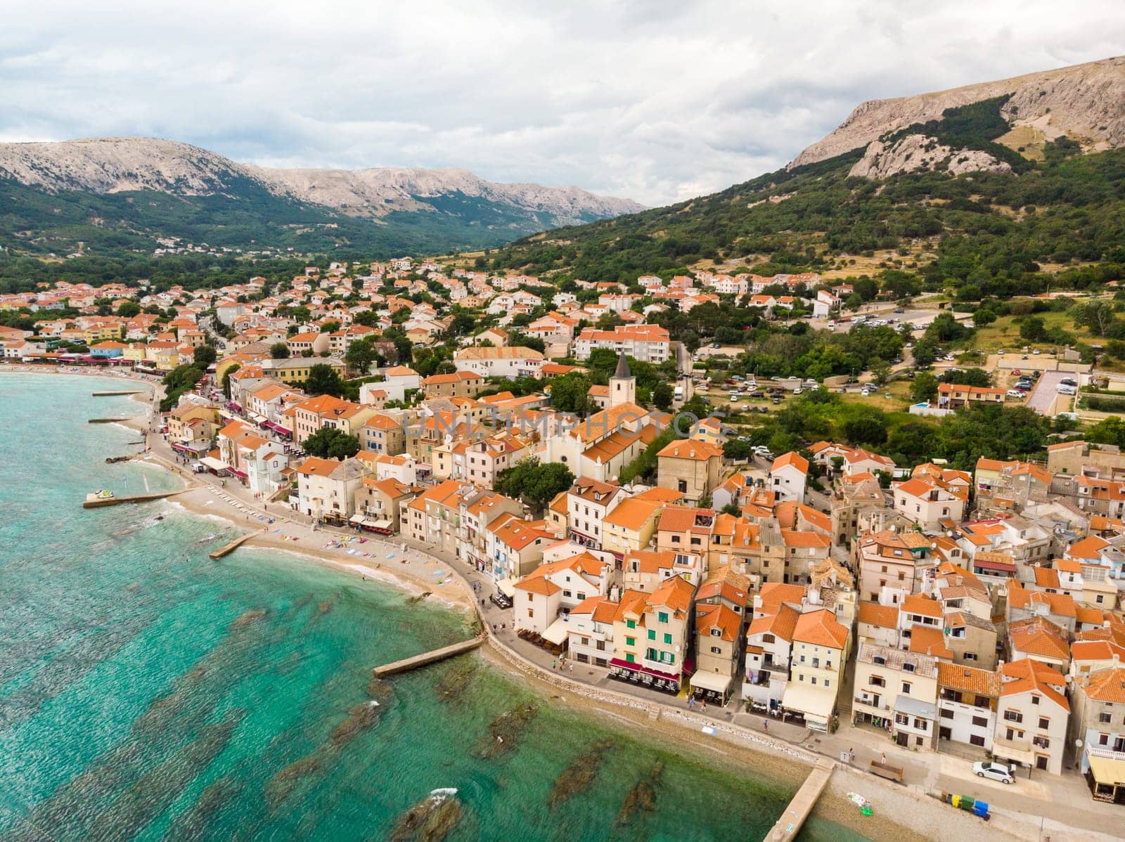 Aerial panoramic view of Baska town, popular touristic destination on island Krk, Croatia, Europe.