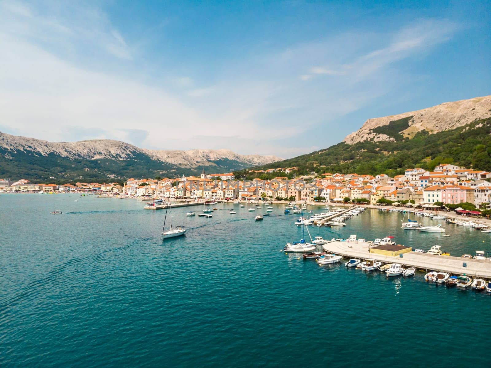Aerial panoramic view of Baska town marina, popular touristic destination on island Krk, Croatia, Europe.