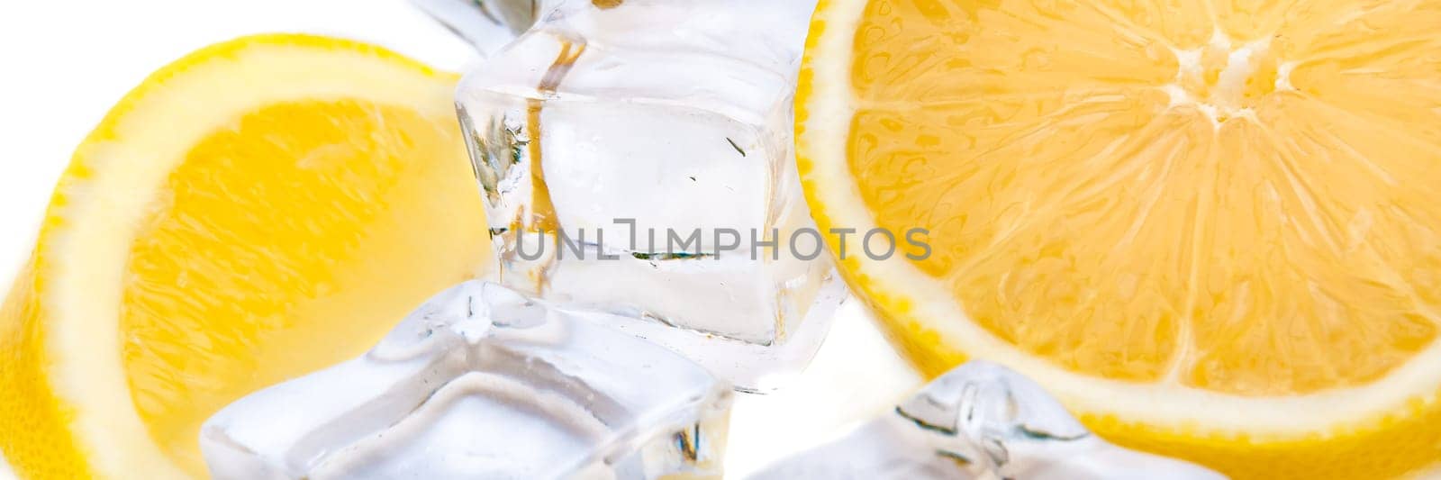 Half a juicy bright lemon and refreshing ice cubes
