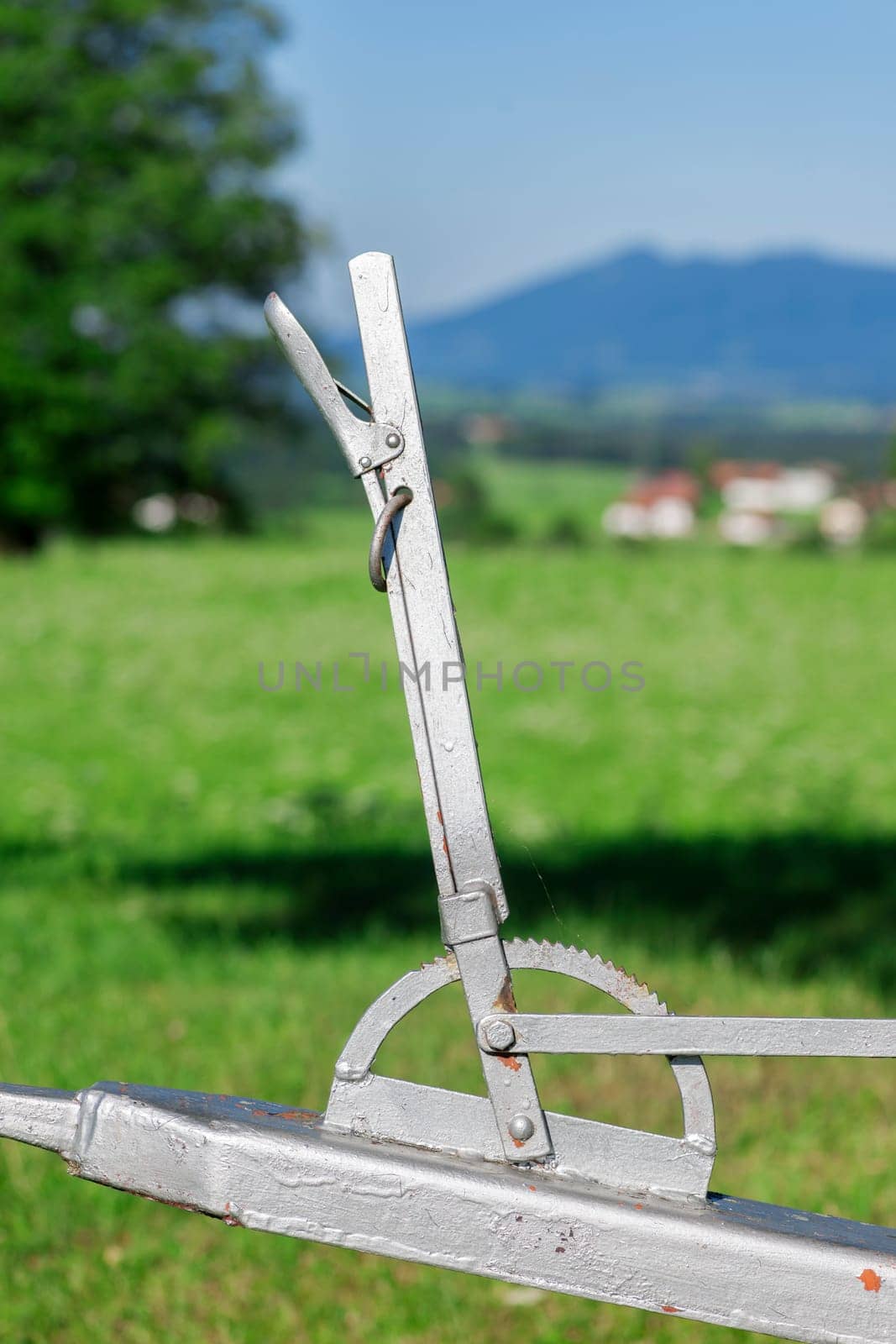 Closeup of an old mobile water potions on green pasture pasture in Bavaria.