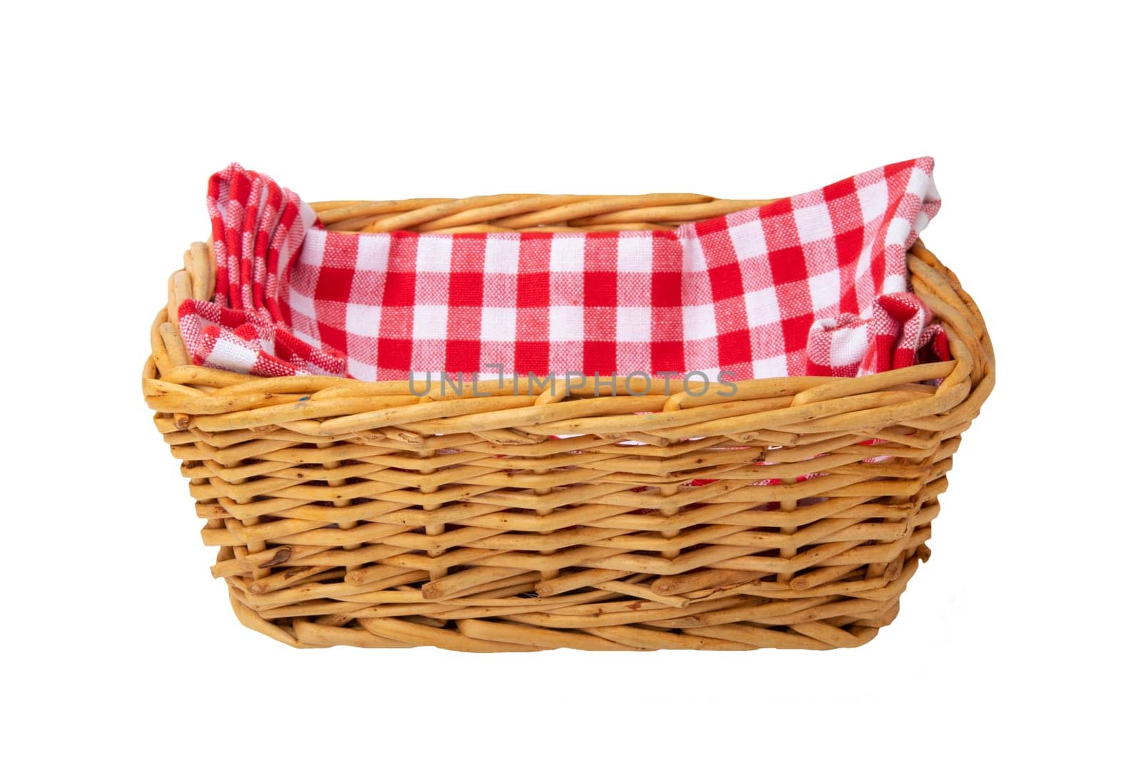 Empty basket therein a red checkered napkin isolated on white background. For your food and product display montage.