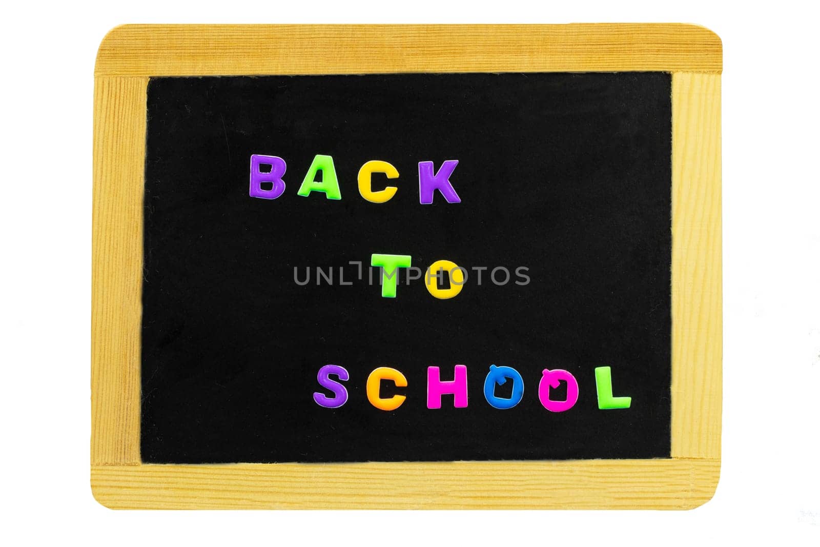 Back to school text written with colorful letters on blackboard. School board isolated on white background. Concept education.