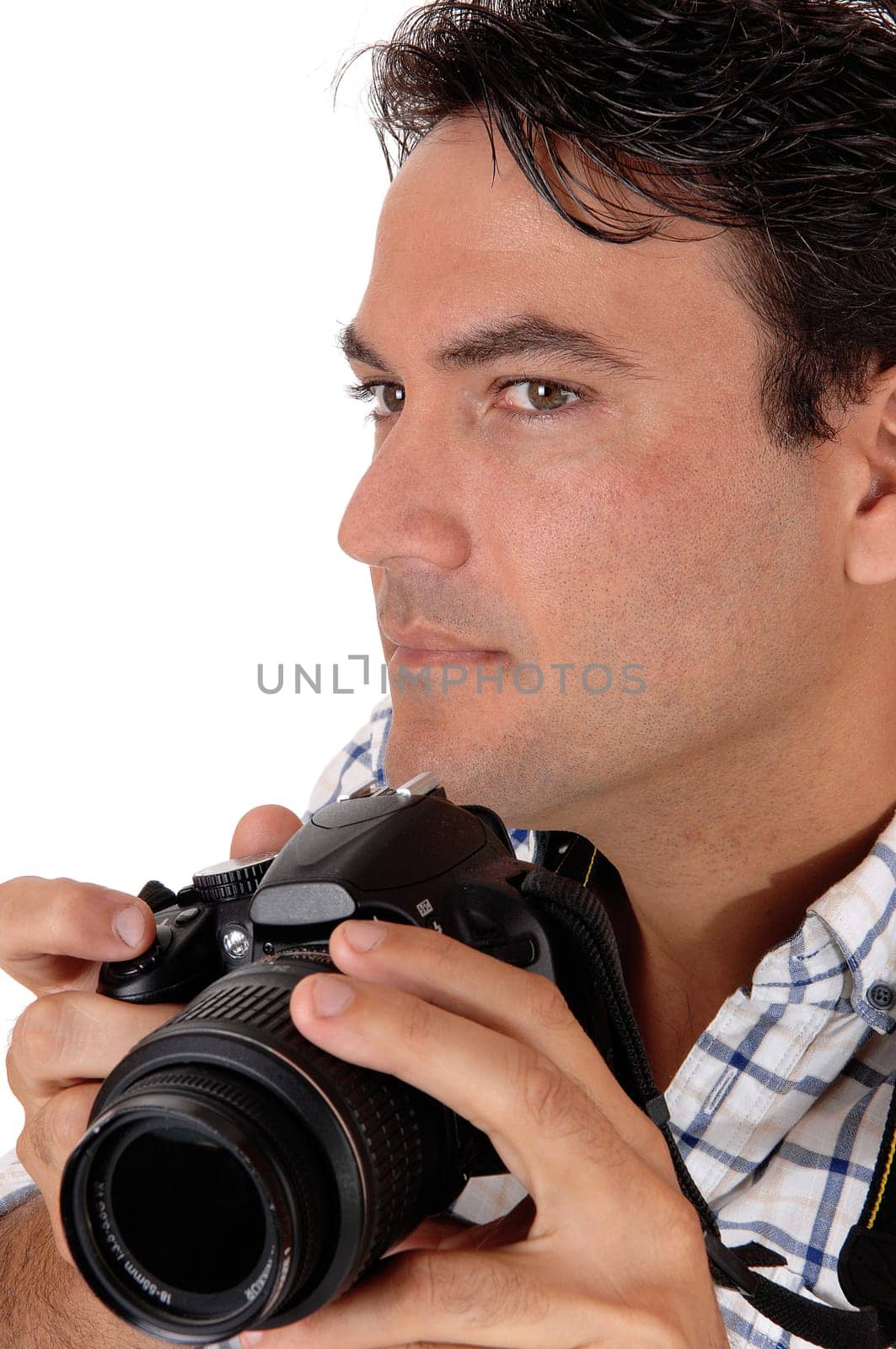 A close-up image of a handsome man holding his camera ready of a .shoot, looking sharp, isolated for white background.
