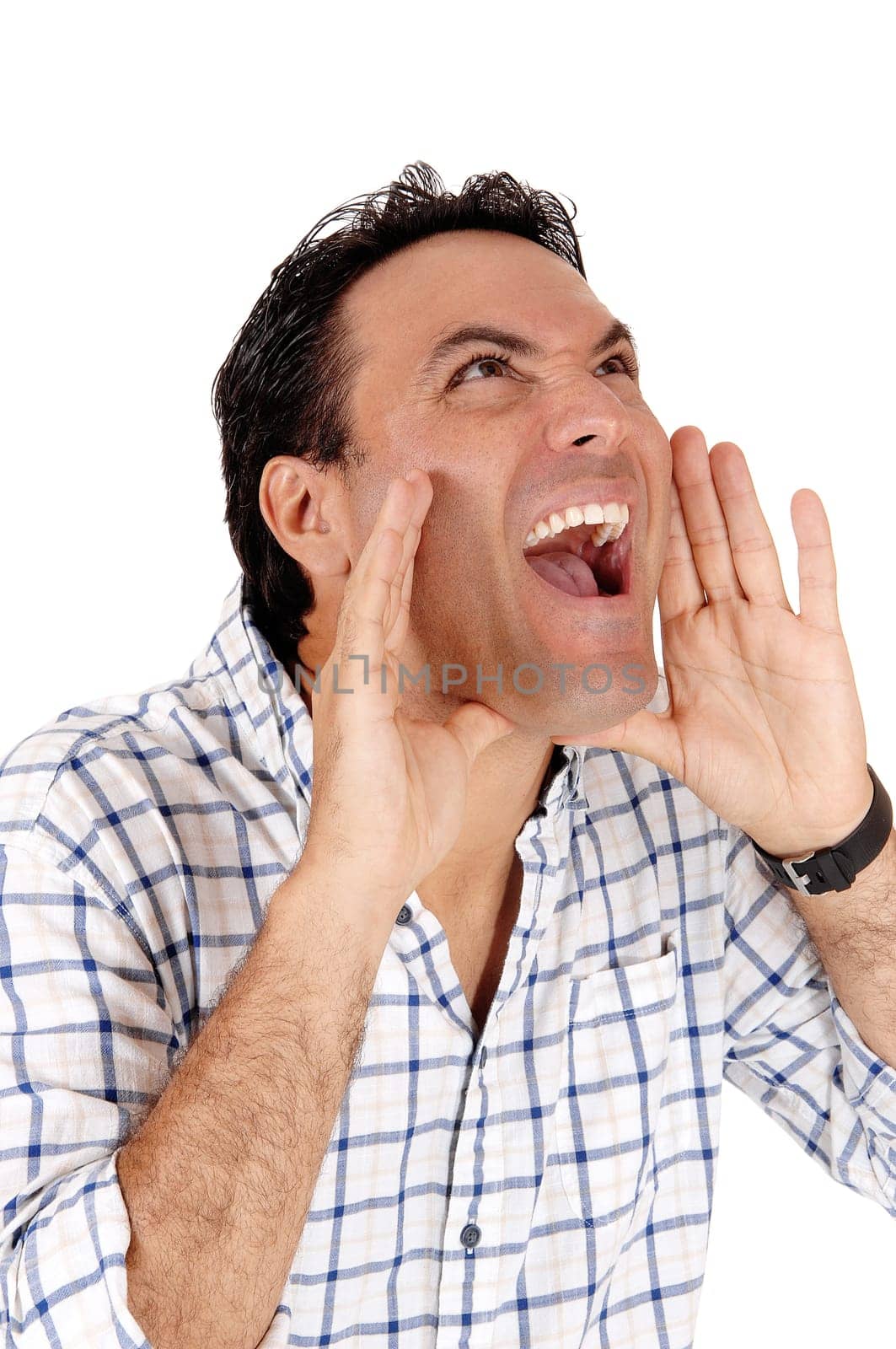 A close up image of a young man with his hands on his mouth and.mouth open shouting lout, isolated for white background.