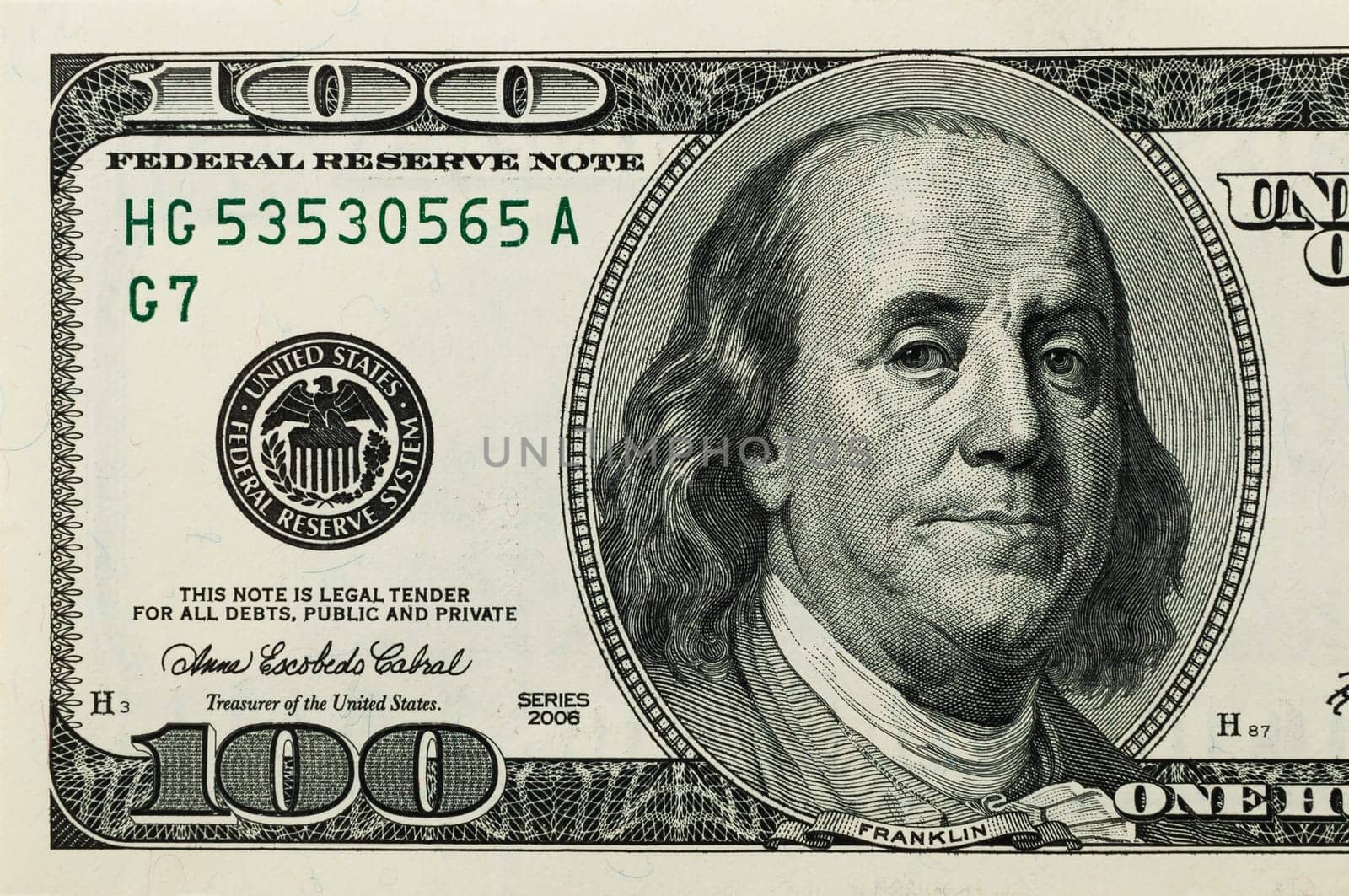 Part of the bill is one hundred US dollars. The left part.