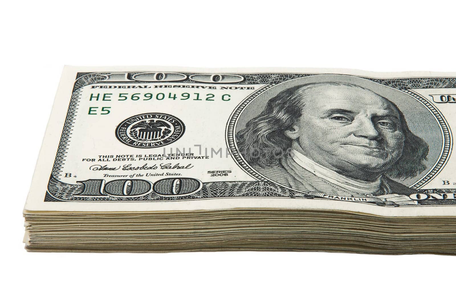 Part of a pack of one hundred dollar bills. View at an angle. Close-up.