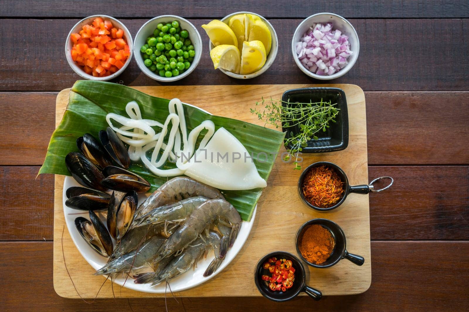 Raw seafood on plate, healthy food, prawn, clam squid.