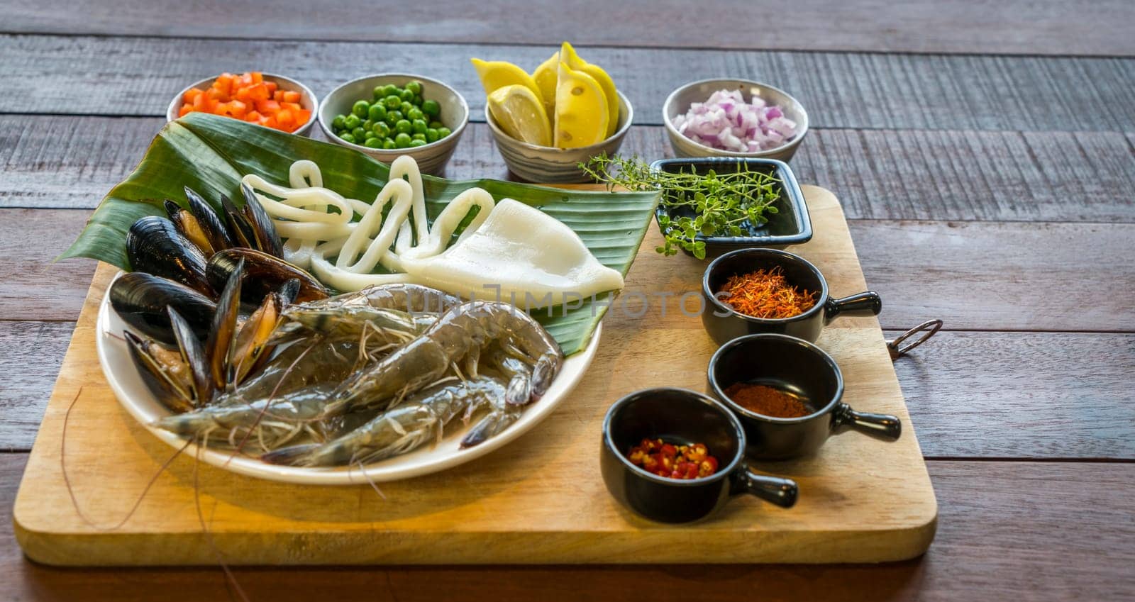 Raw seafood on plate, healthy food, prawn, clam squid.