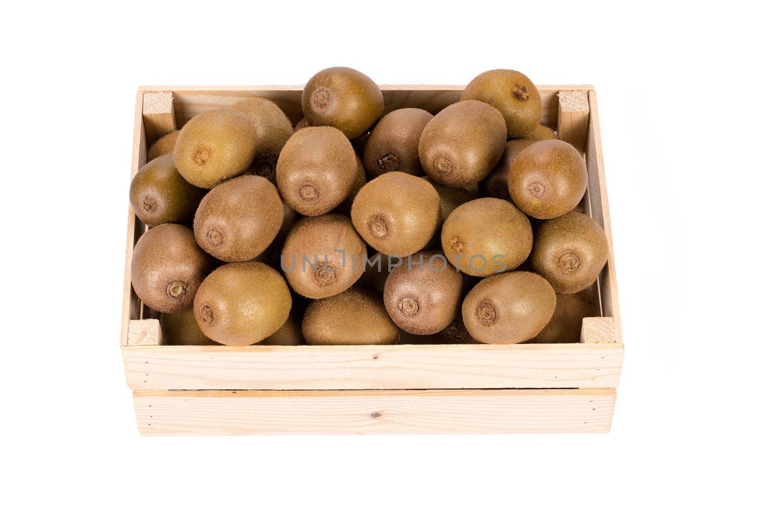 Wooden Box filled with many ripe and fresh Kiwi fruits isolated in white background