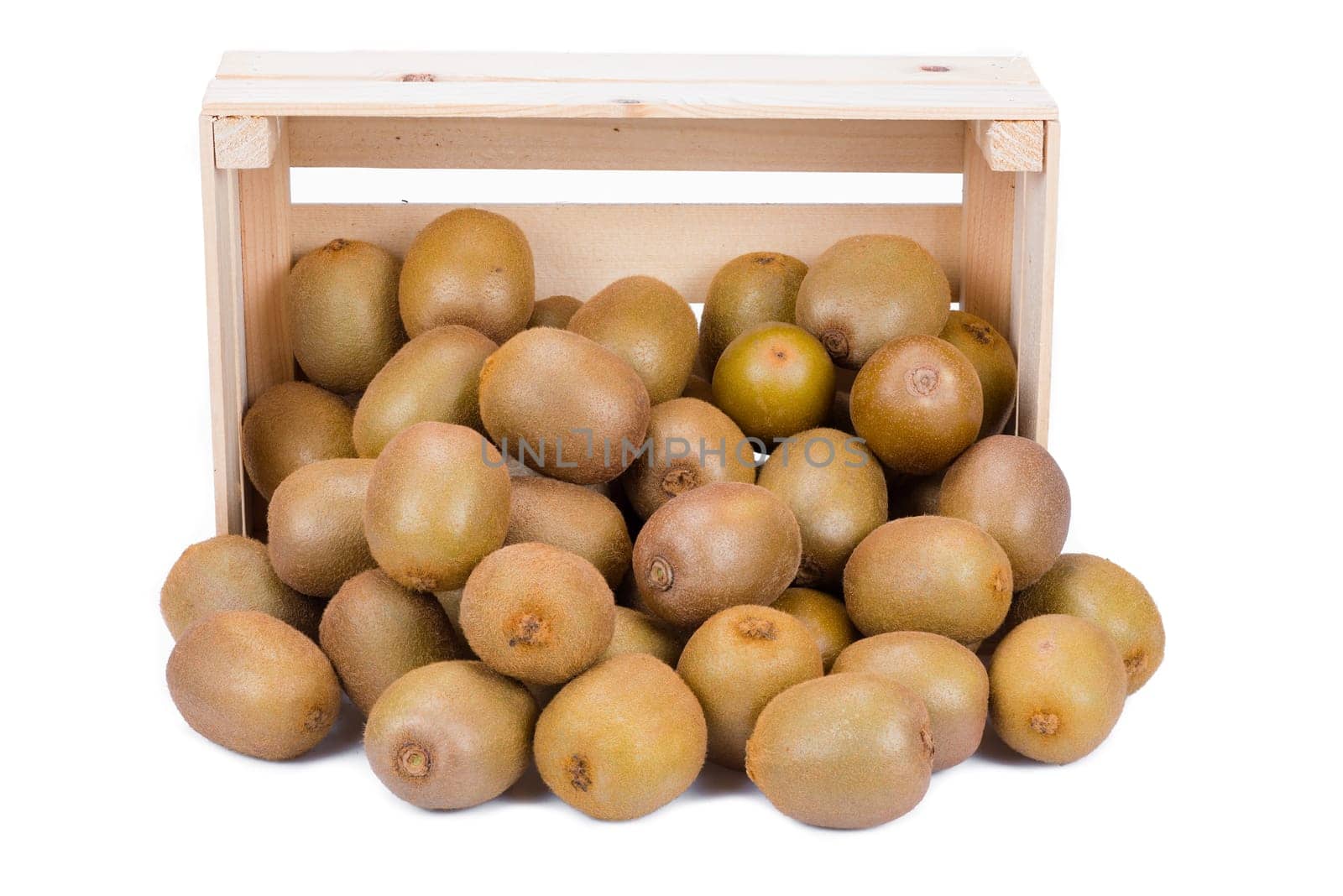 Wooden box with many ripe kiwi fruits in front of it isolated on white background