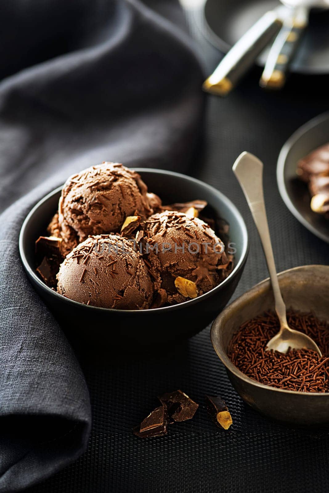 Homemade Organic chocolate Ice Cream scoops decorated with chocolate sprinkles