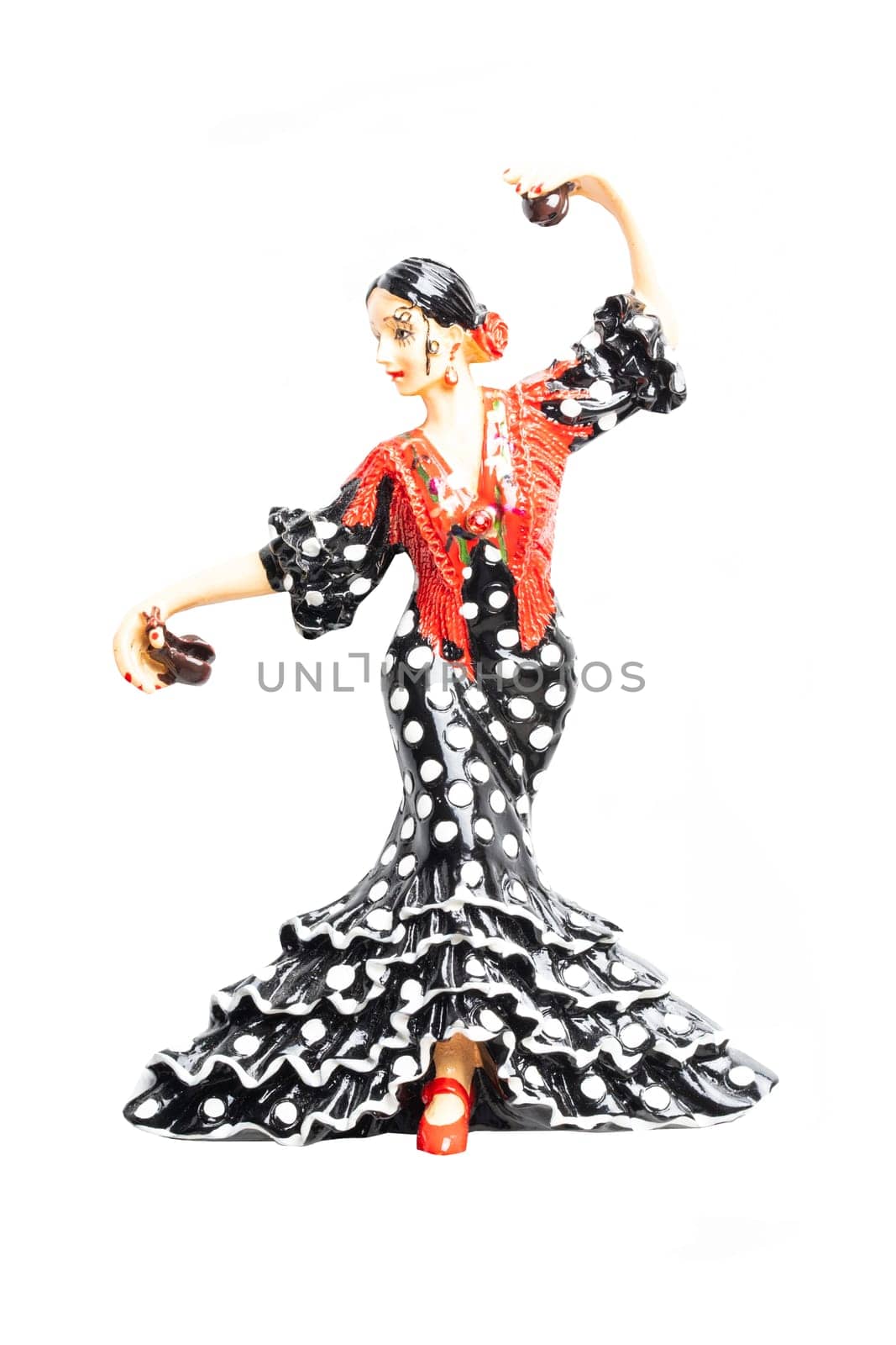 Spanish flamenco dancer. Close-up of woman dancing flamenco in traditional costume. Ceramic figure.