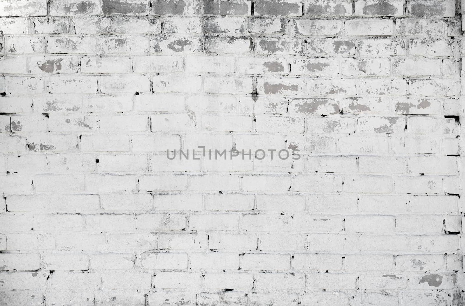 White brick wall background. Grunge weathered texture.