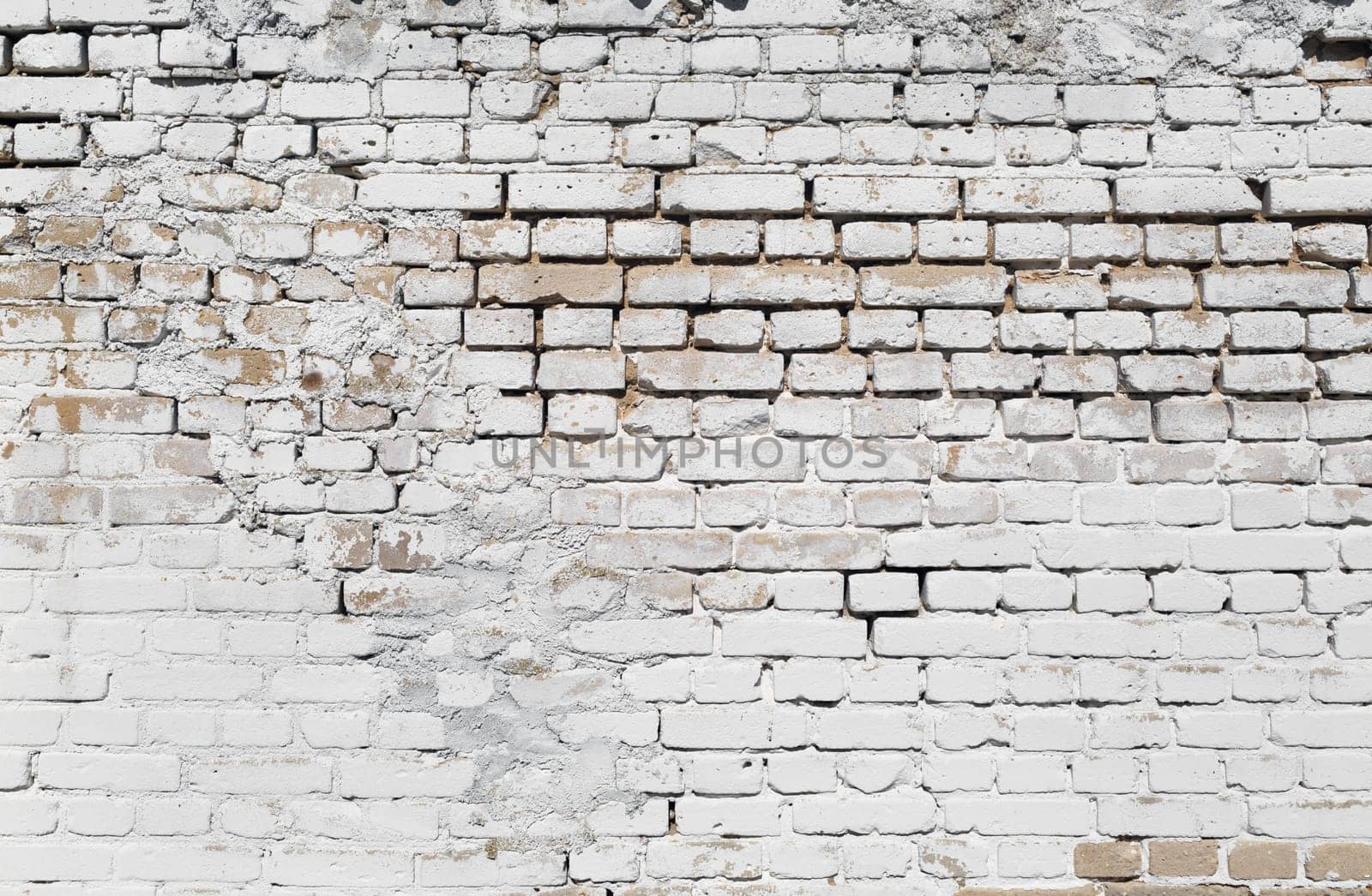 Grunge brick wall background. Old white brickwork.
