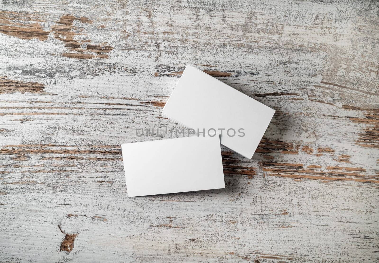 Blank business cards on wooden background. Mockup for branding identity. Studio shot. Flat lay.