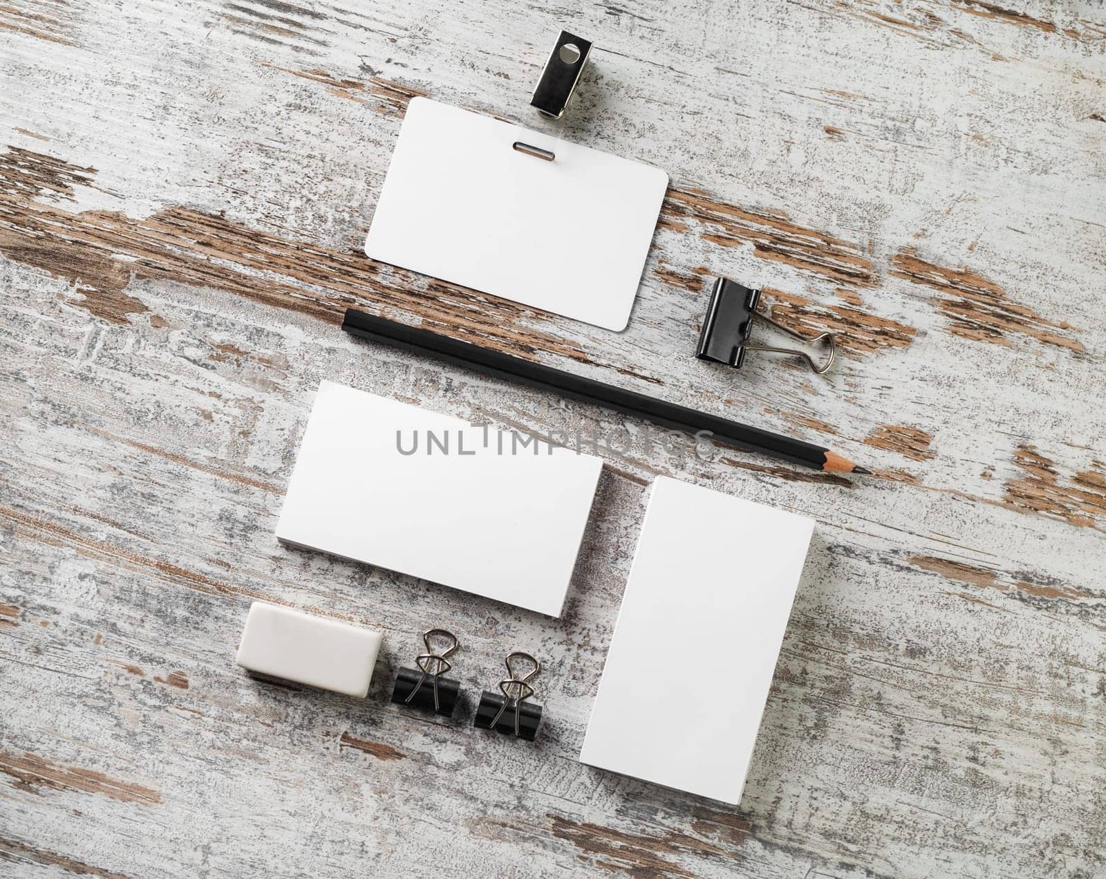Blank stationery set on wood table background. Responsive design template. Flat lay.