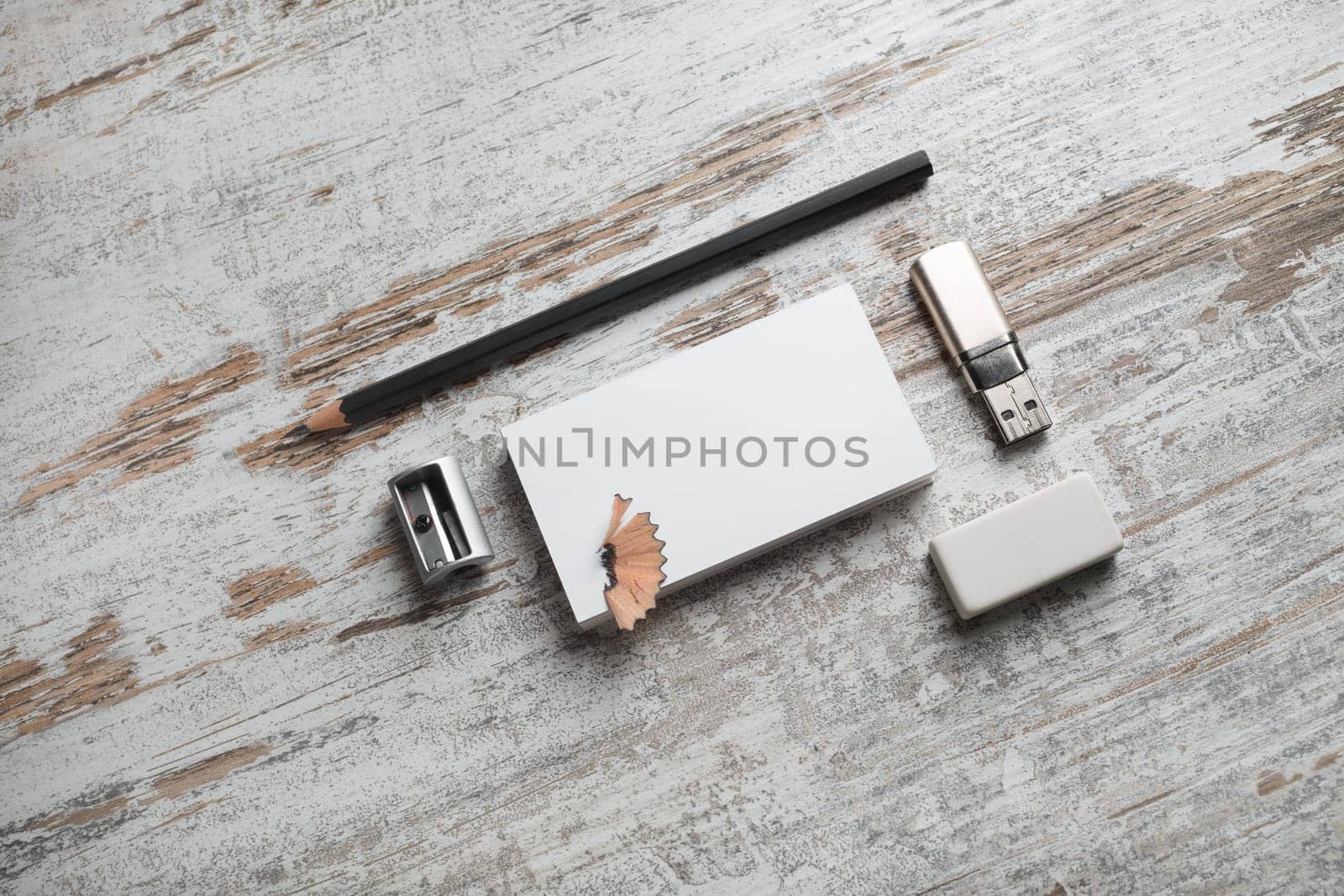 Blank branding stationery set on wood background. Top view.