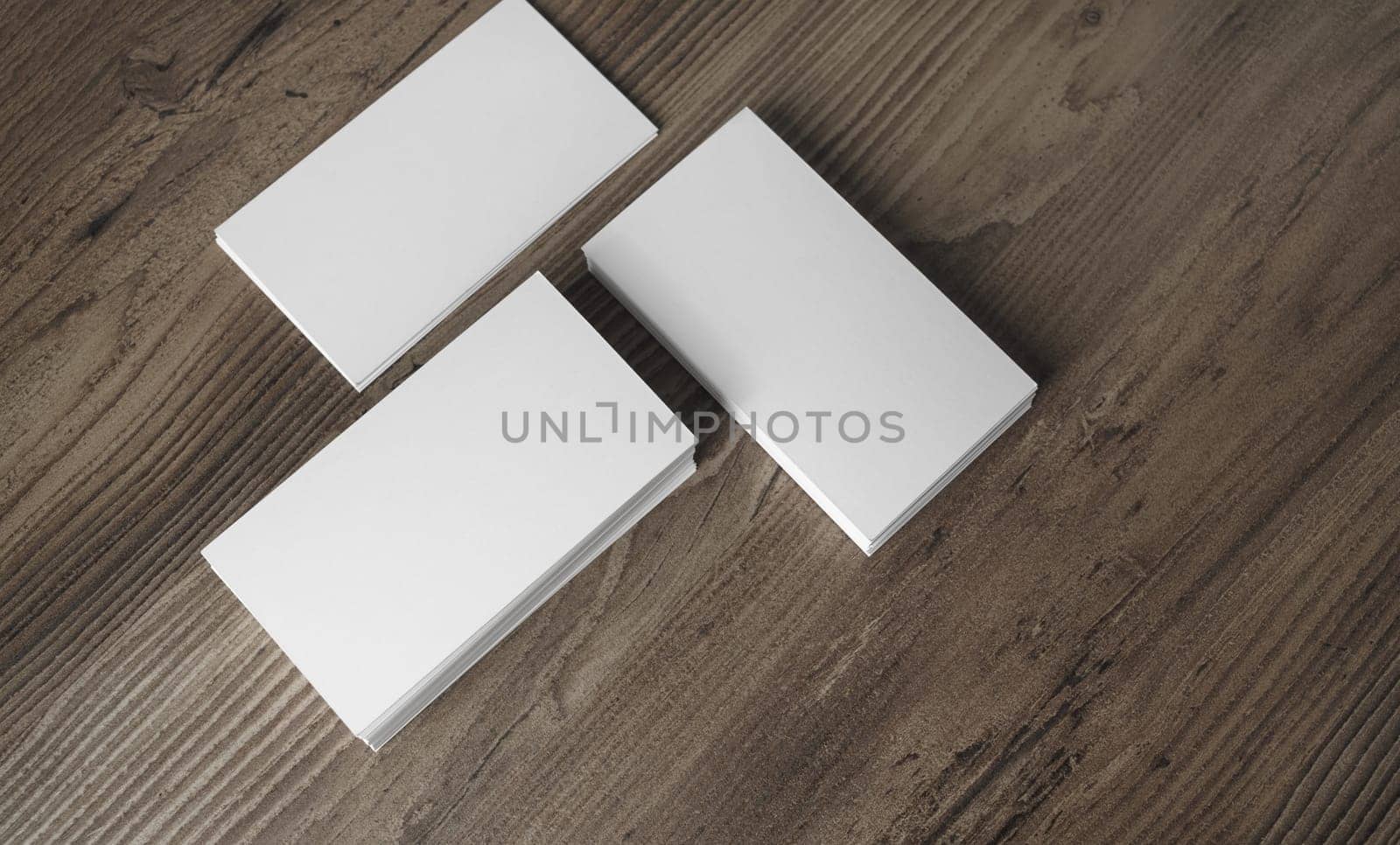 Photo of blank business cards on wooden background. Template for ID. Top view.