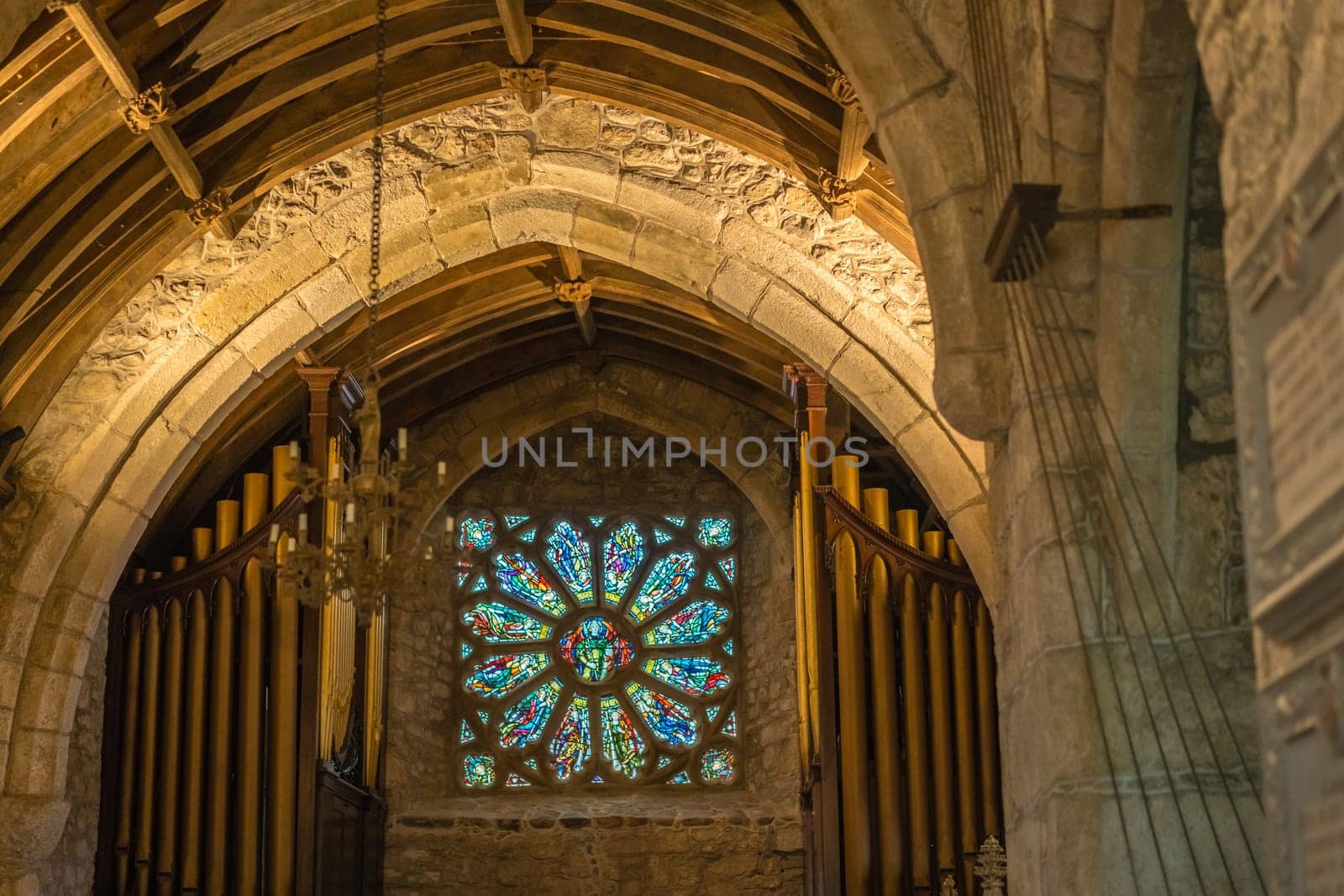 Marazion, England -  May 2018 : Victorian stained glass church window in St Michael`s Mount castle chapel, depicting saints and various religious scenes, Cornwall