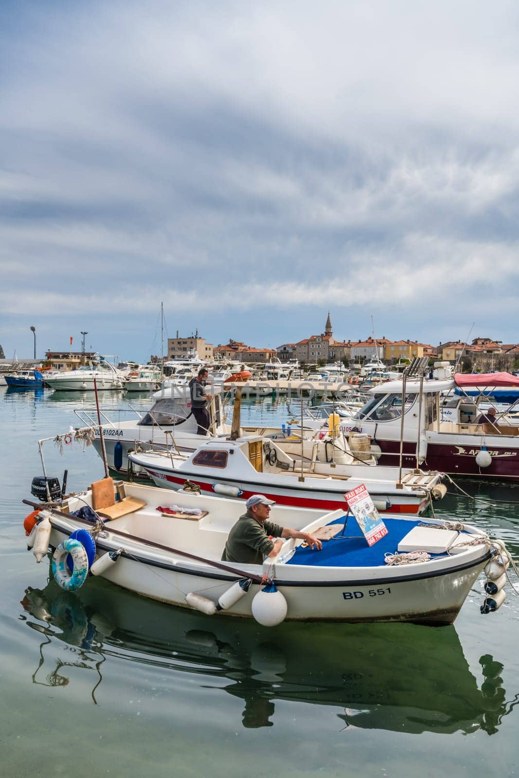 Budva, Montenegro - April 2018 :  Yachts and boats moored in the port in Budva town