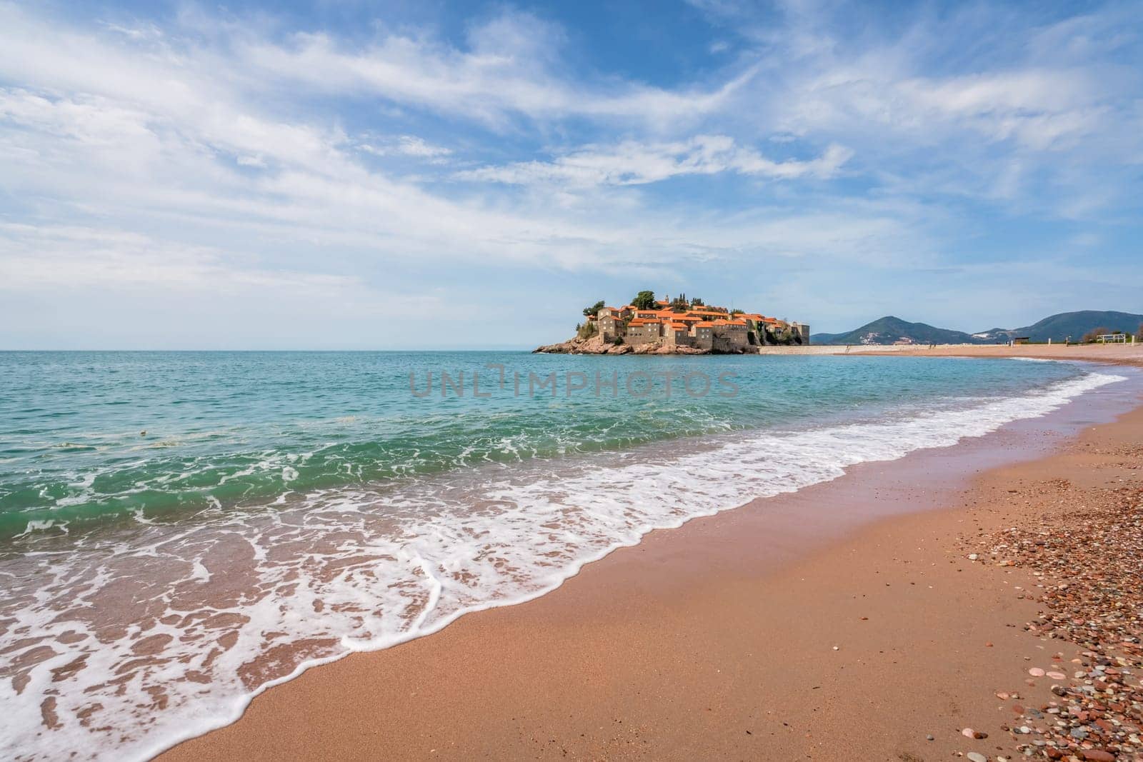 Sveti Stefan, Montenegro - April 2018 :  Beach in front of the historical old town, currently privately owned and turned into an expensive luxury hotel