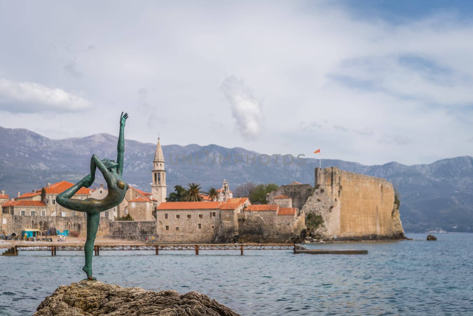 Budva, Montenegro - April 2018 :  The statue of Ballerina Dancer, standing on the rock, Budva landmark, Montenegro