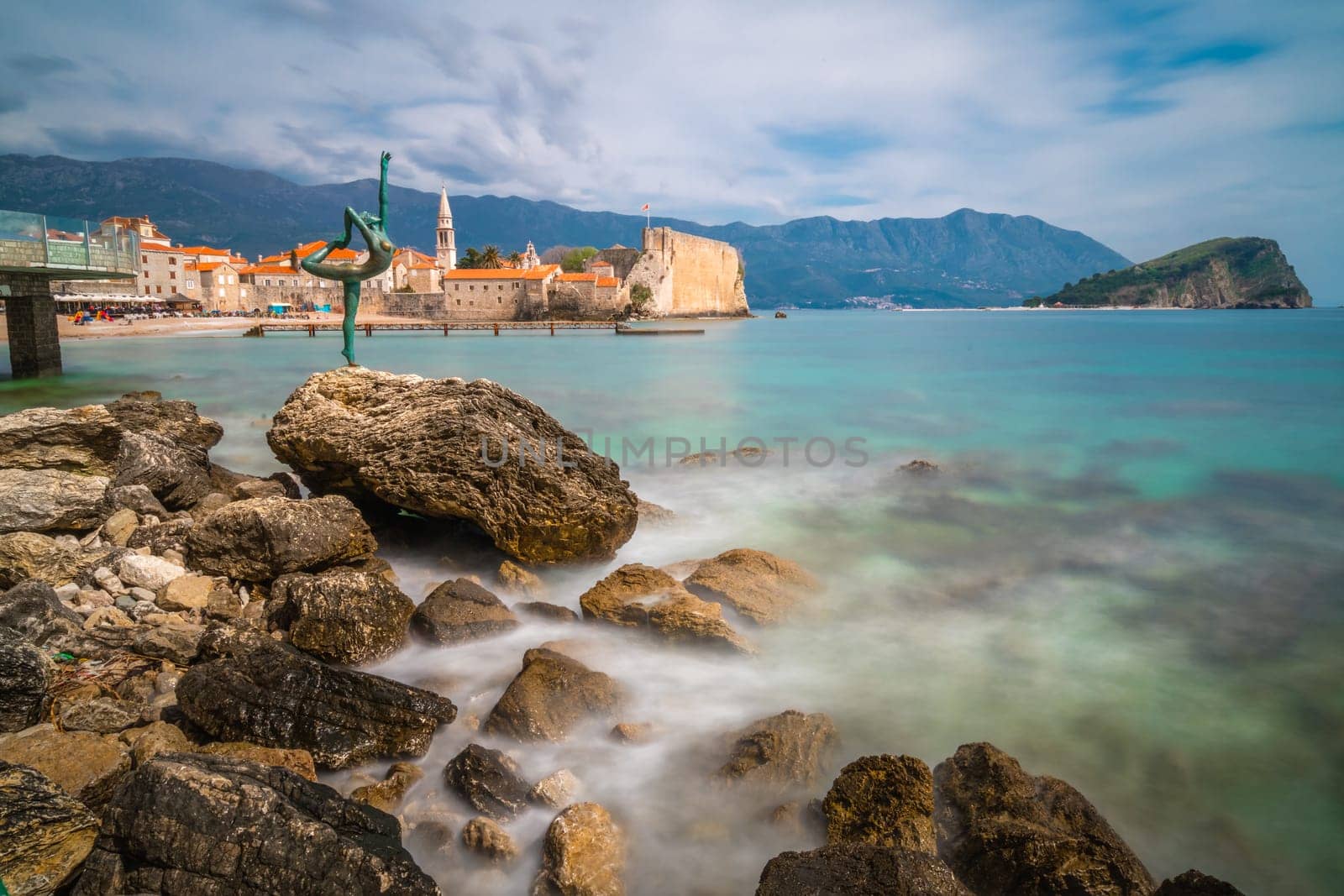 Budva, Montenegro - April 2018 :  The statue of Ballerina Dancer, standing on the rock, Budva landmark, Montenegro